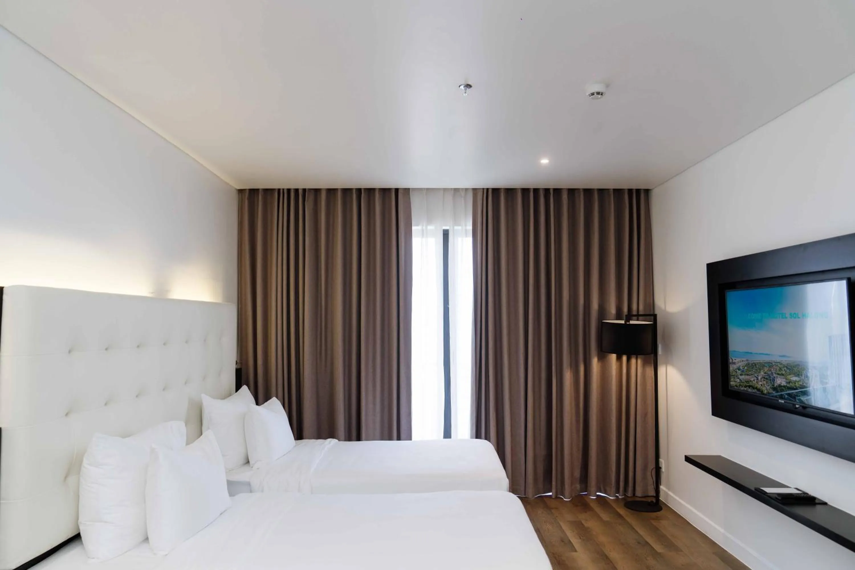 Bed in Hotel Soleil Ha Long, Trademark Collection by Wyndham