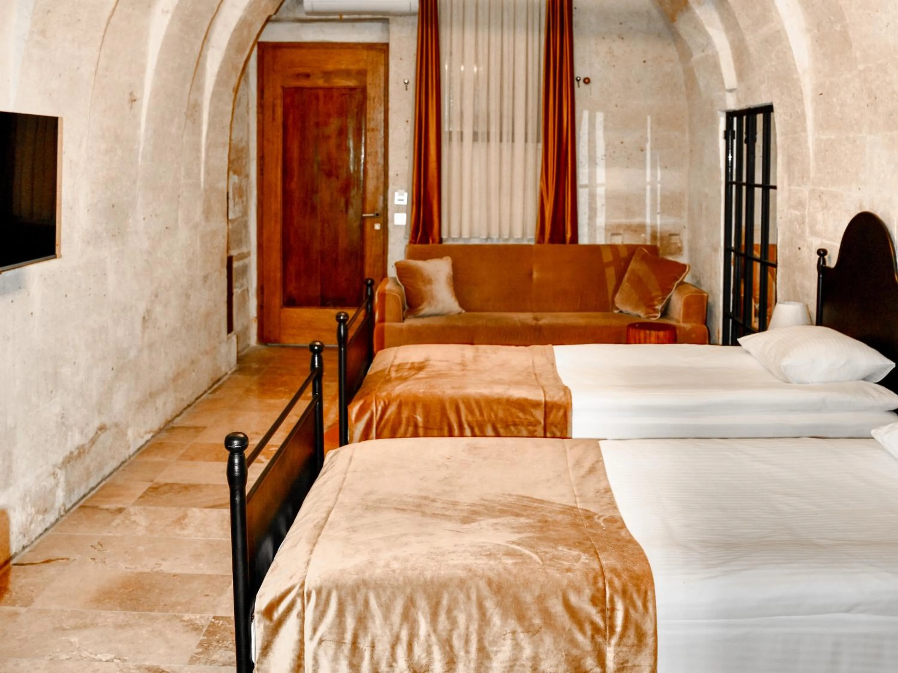 Bed in Evanthia Cave Suites - Special Class