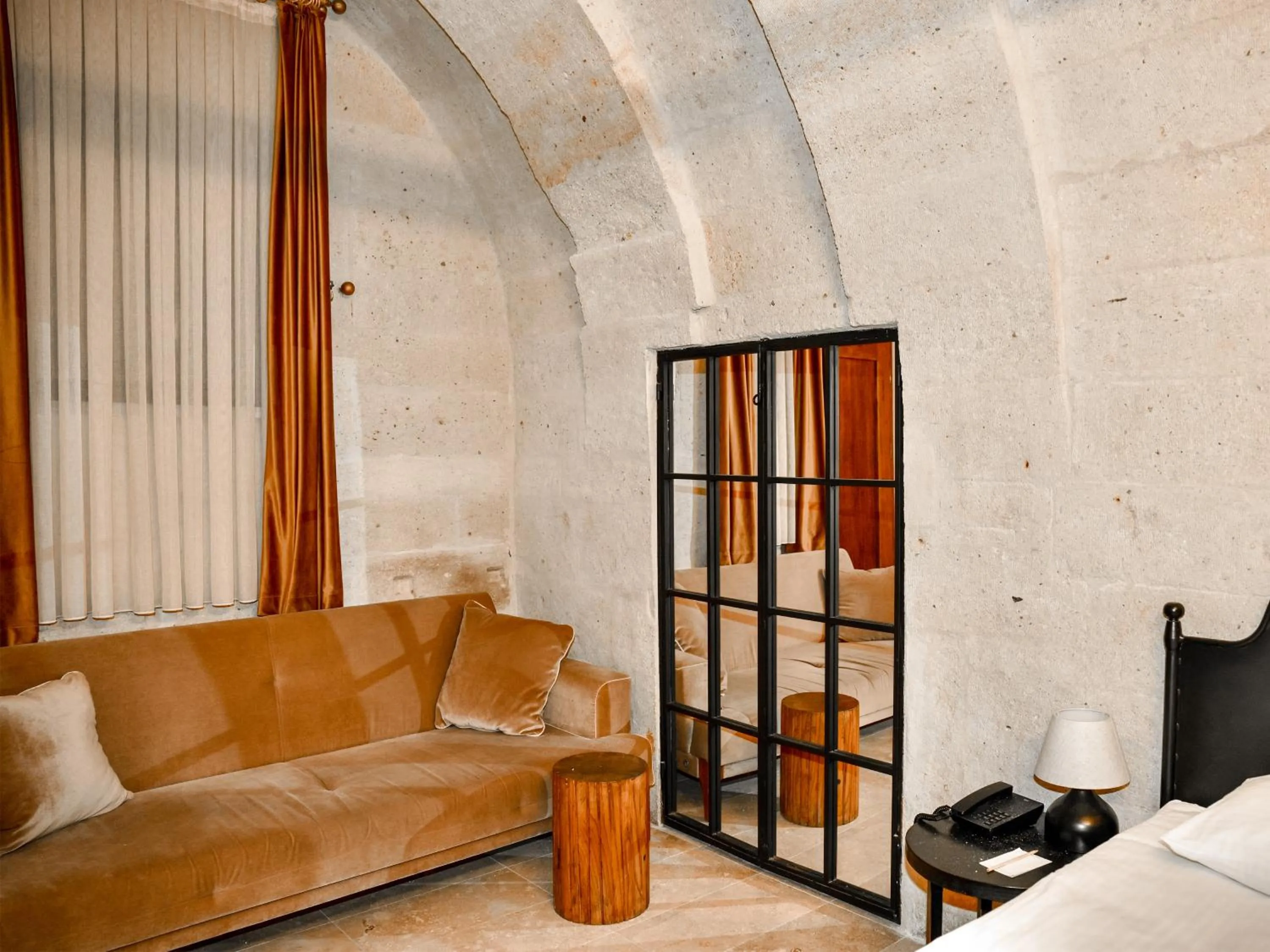 Seating area, Bed in Evanthia Cave Suites - Special Class