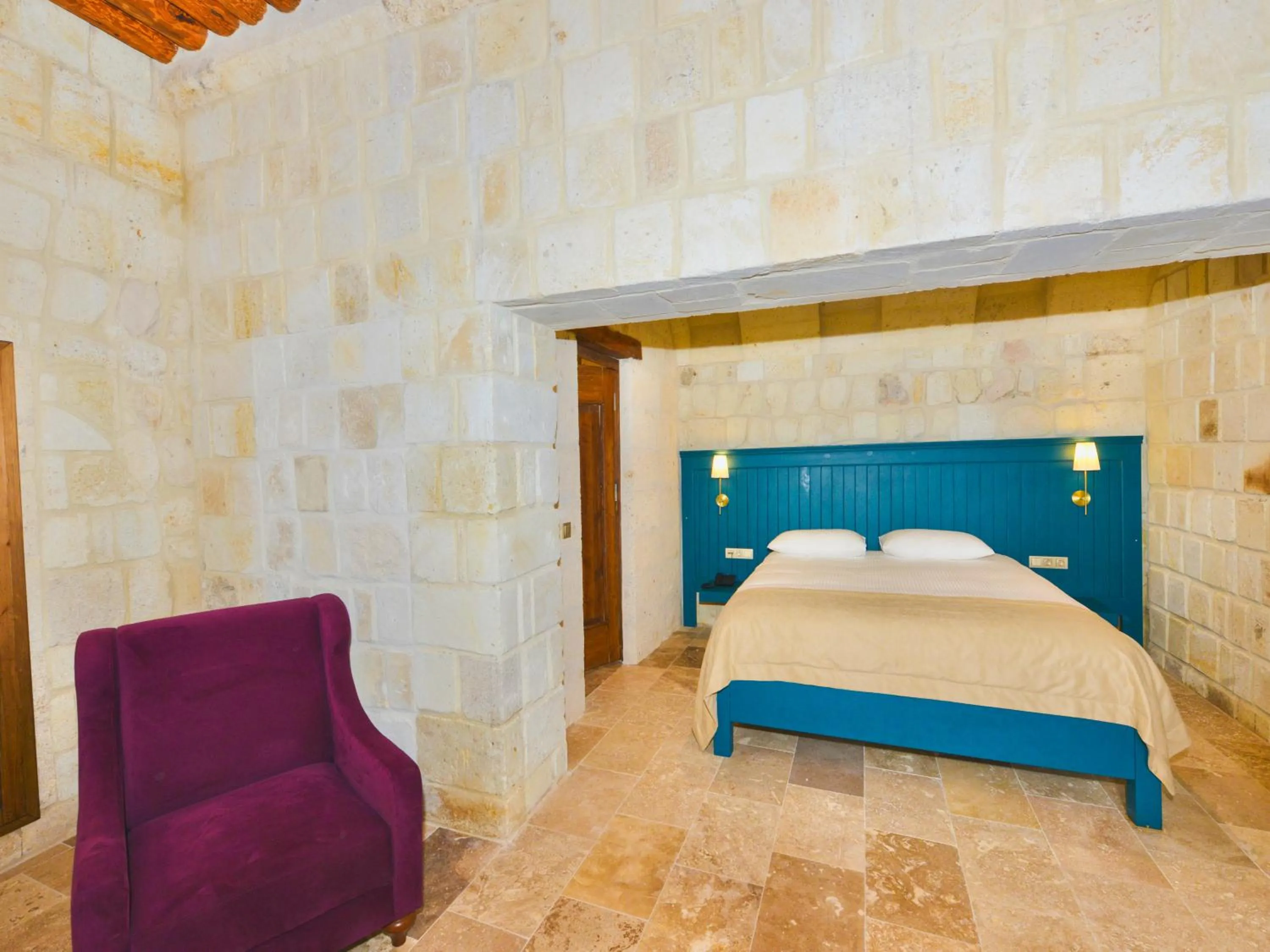 Bed in Evanthia Cave Suites - Special Class