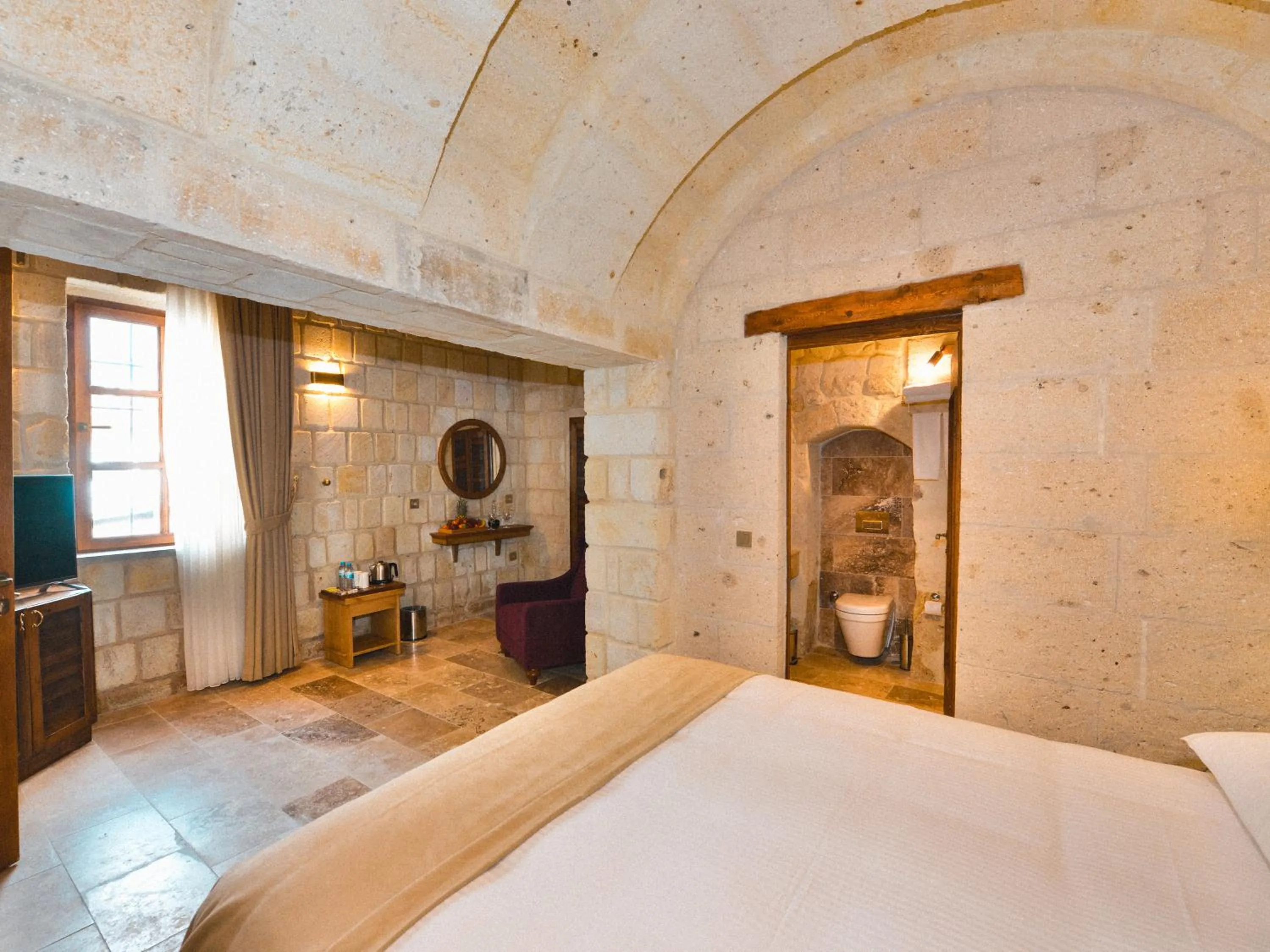 Bed in Evanthia Cave Suites - Special Class