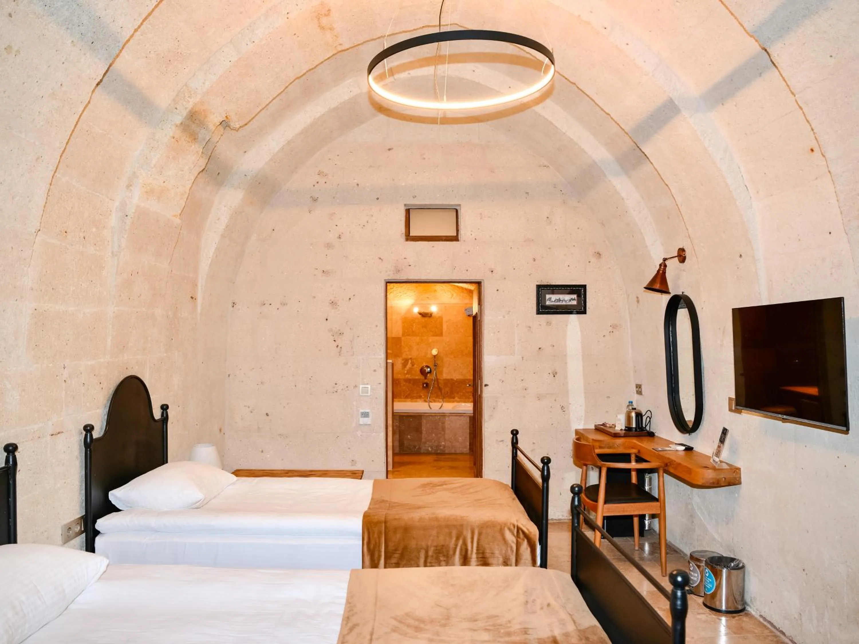 Bed in Evanthia Cave Suites - Special Class