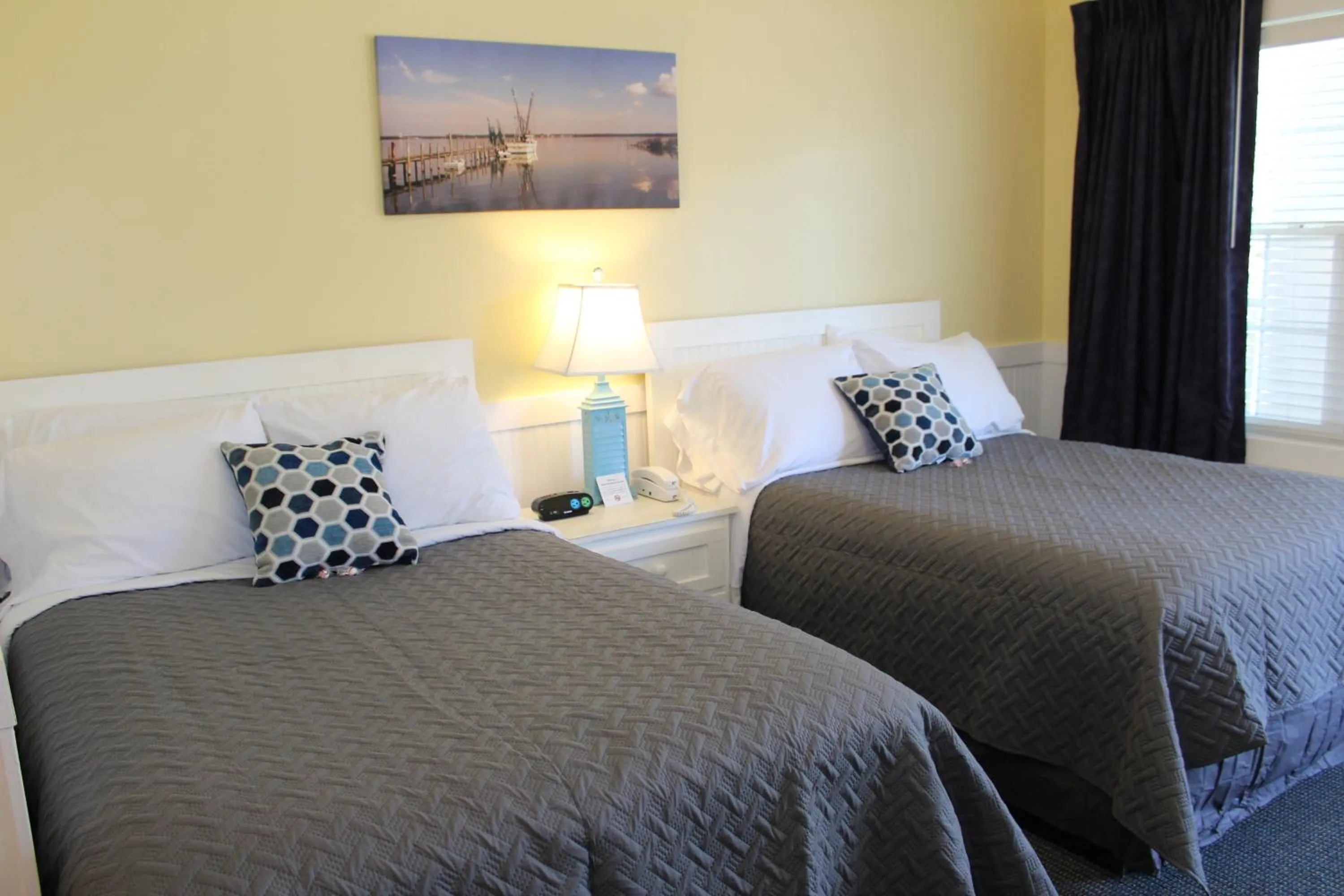 Bed in Topsail Shores Inn