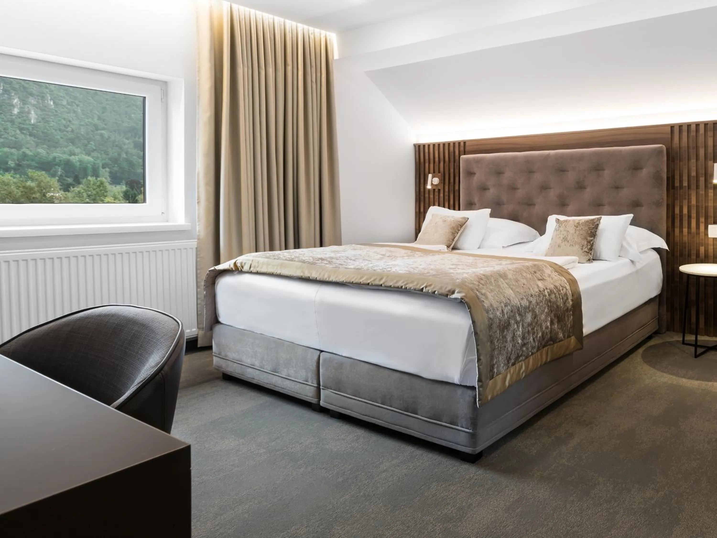 Bed in Garni Hotel Cirman