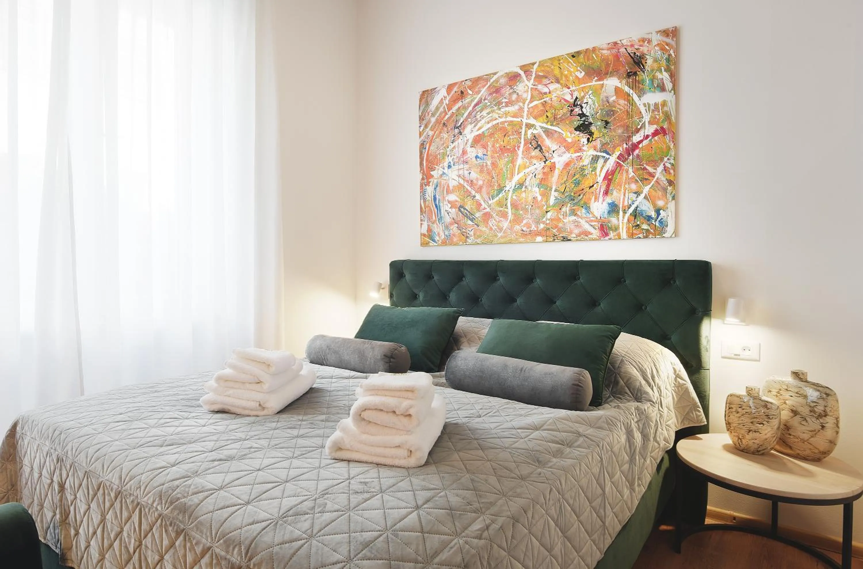 Bed in Emi Luxury Apartments