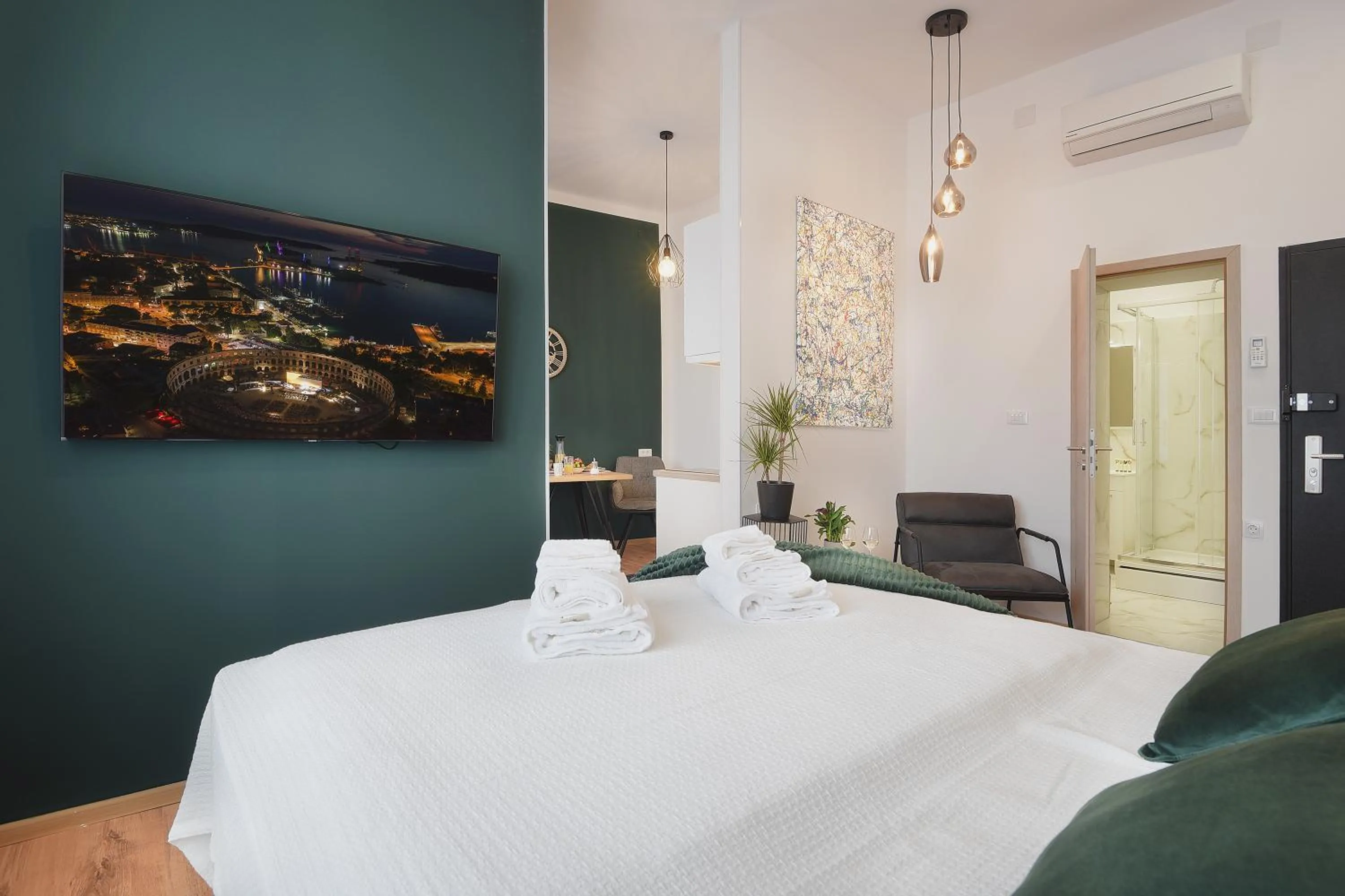 Bed in Emi Luxury Apartments