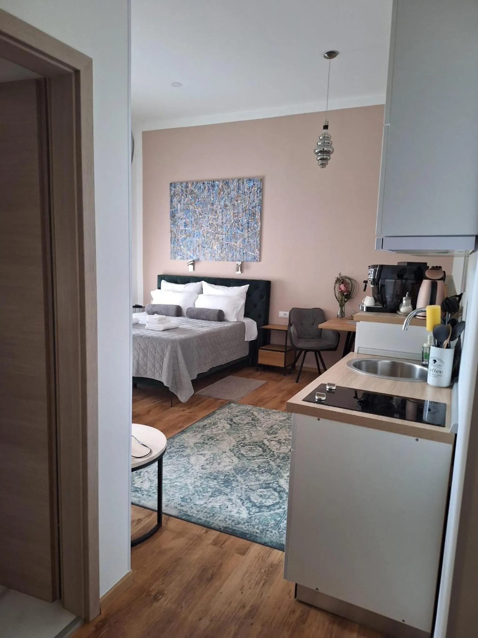 Bed in Emi Luxury Apartments