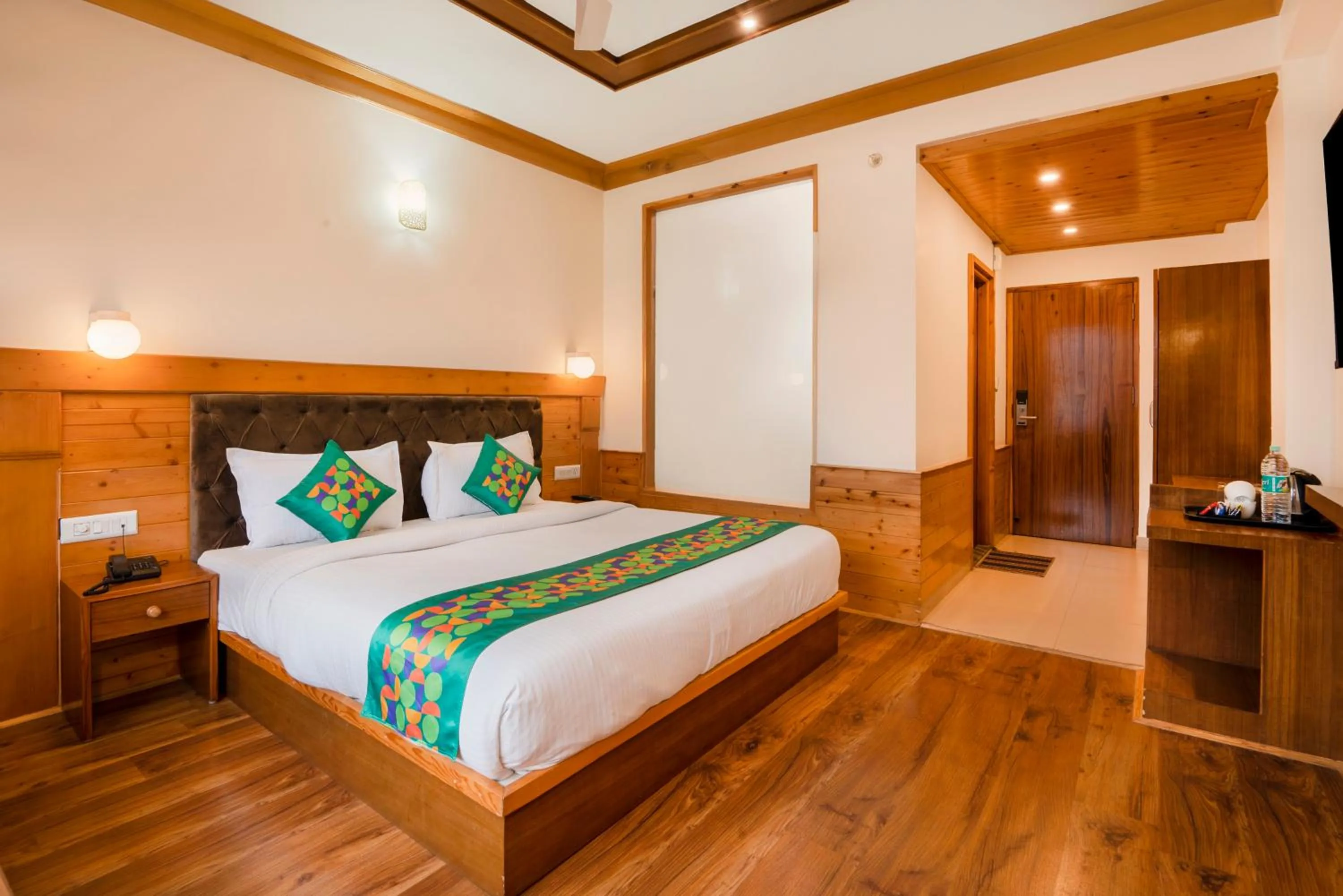 Bedroom, Bed in Treebo Premium Sattva With Mountain View