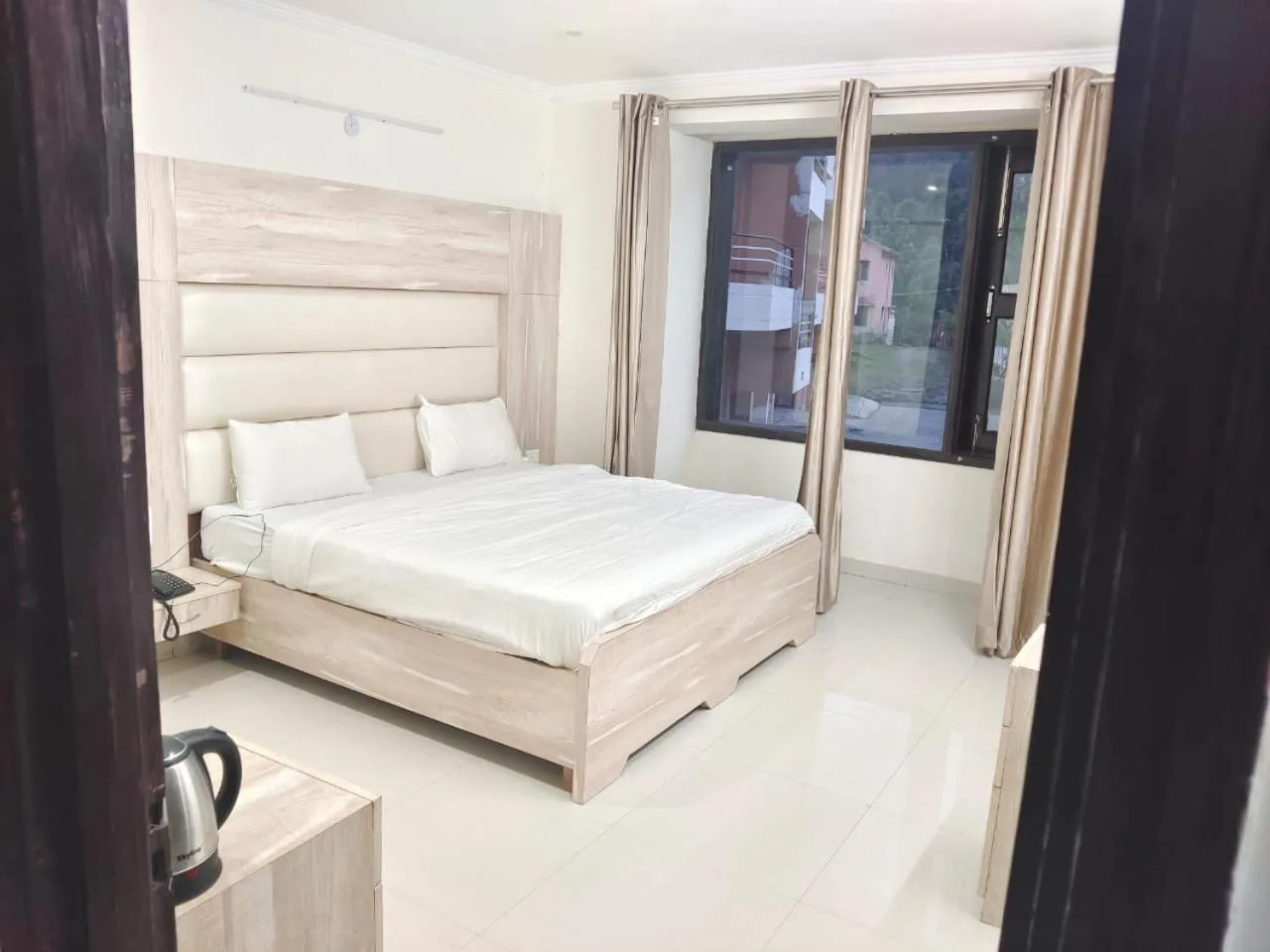 Bed in Just Naturals Wellness Resort Nainital