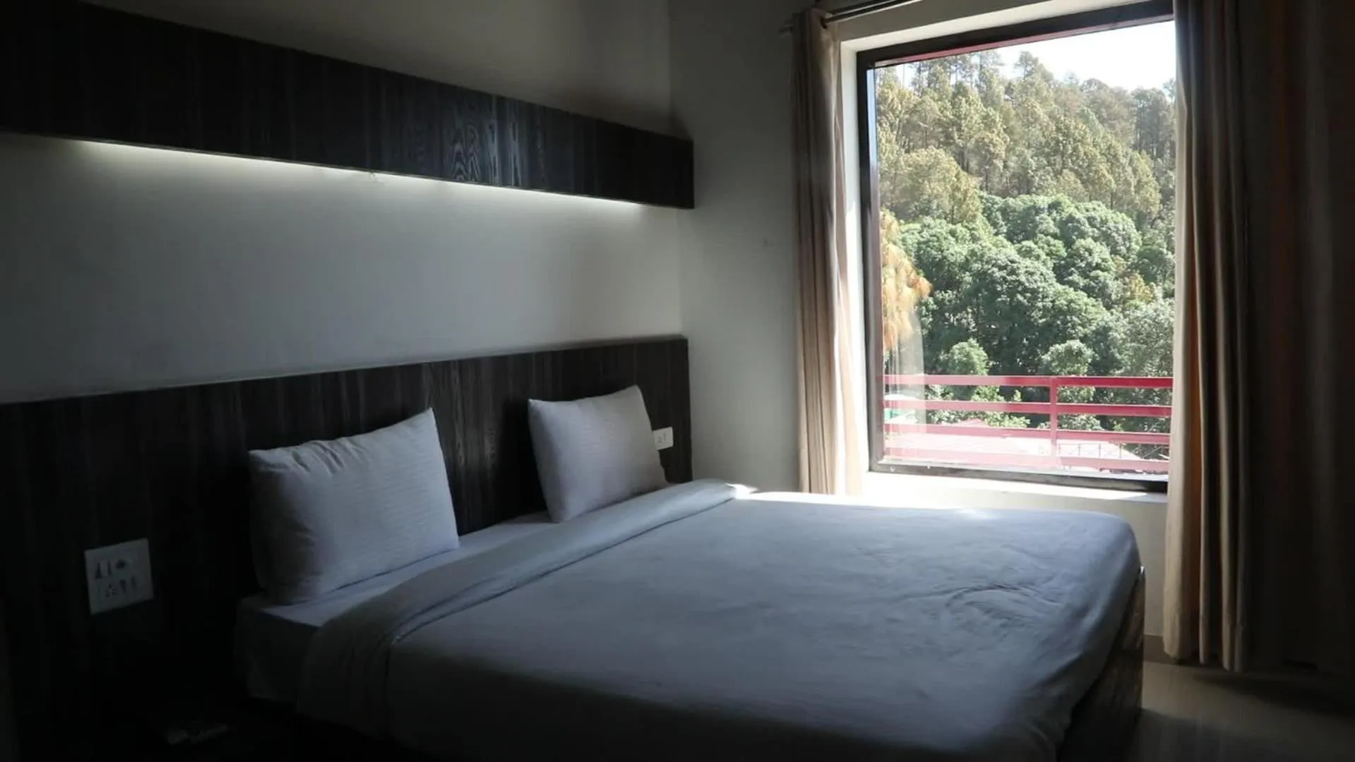 Bed in Just Naturals Wellness Resort Nainital