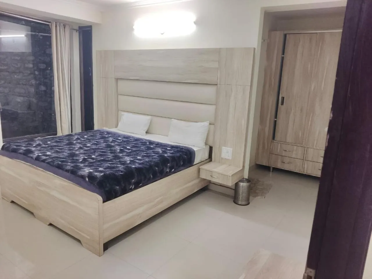 Bed in Just Naturals Wellness Resort Nainital