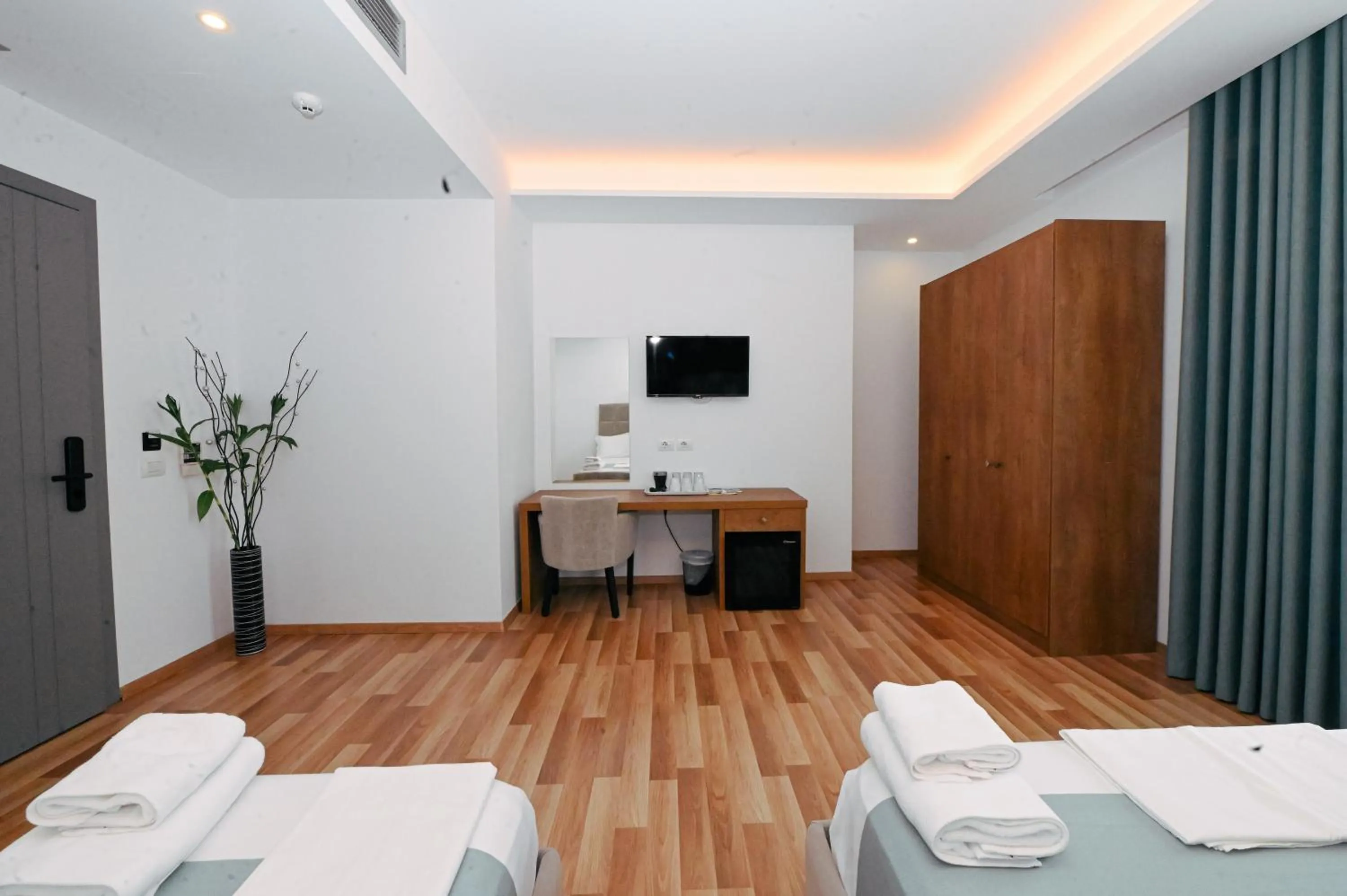 Communal lounge/ TV room, Bed in Bianco Hotel