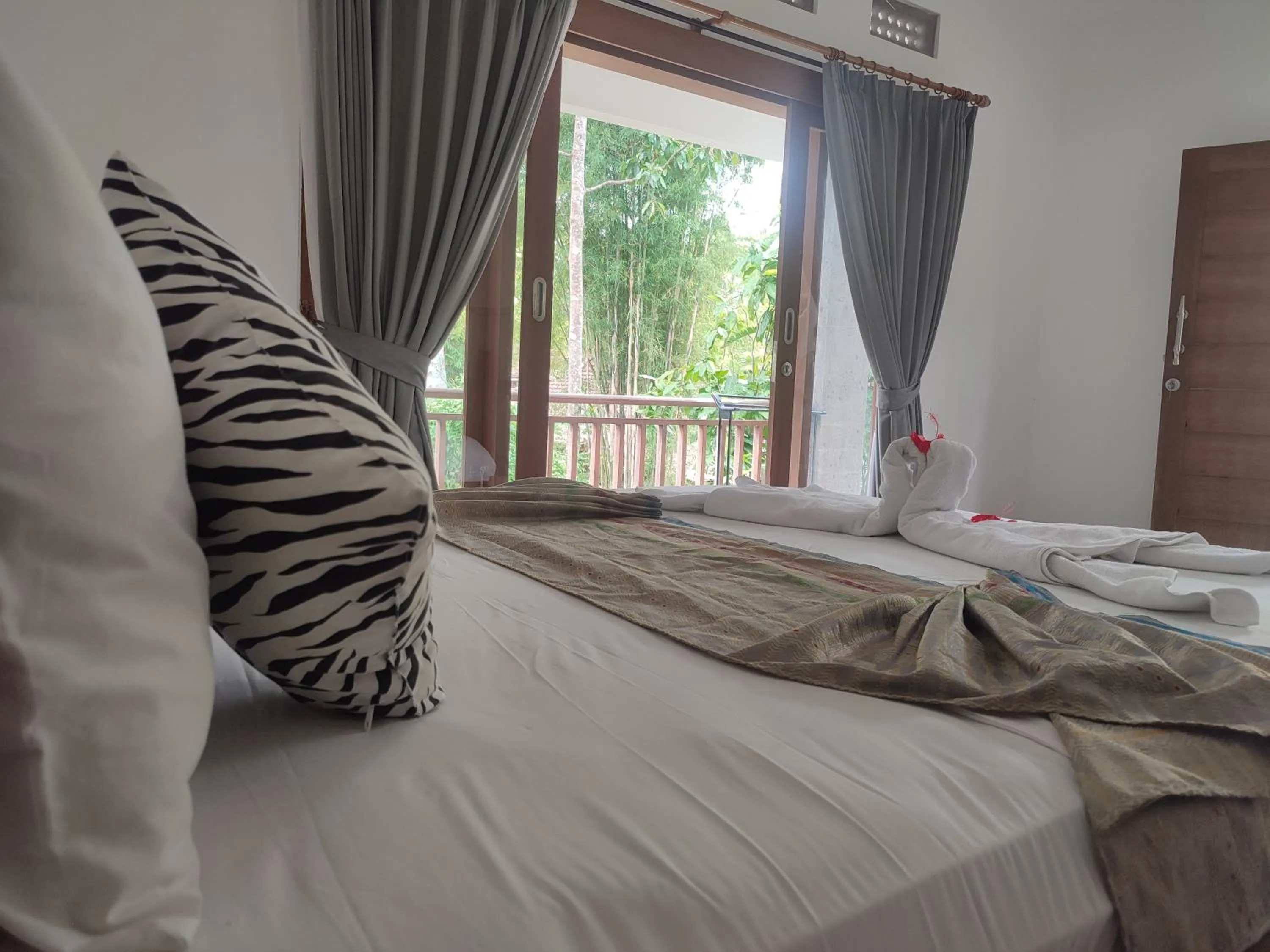 Bed in Nyoman Homestay Ubud