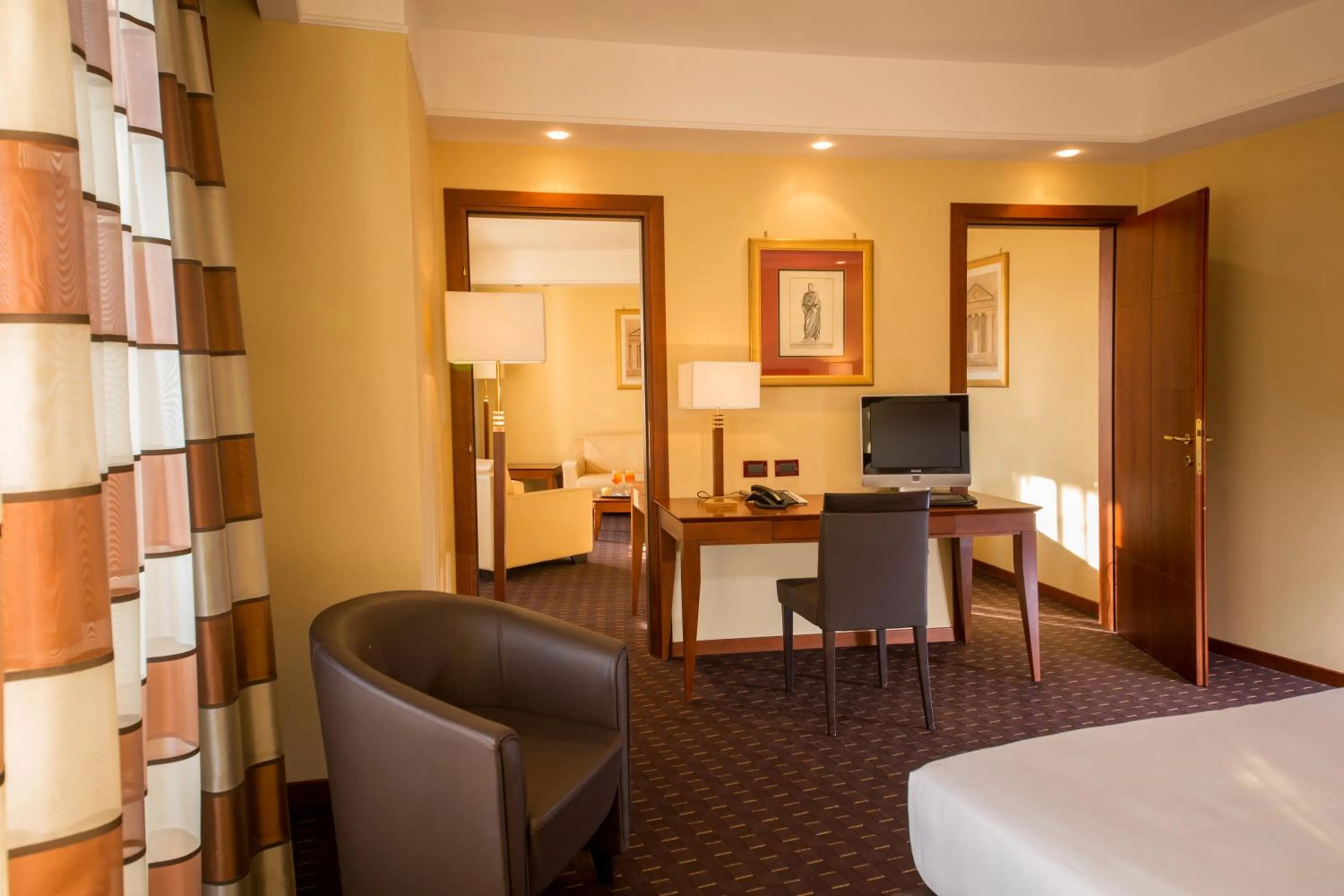 Living room, Bed in Hotel Capannelle Roma