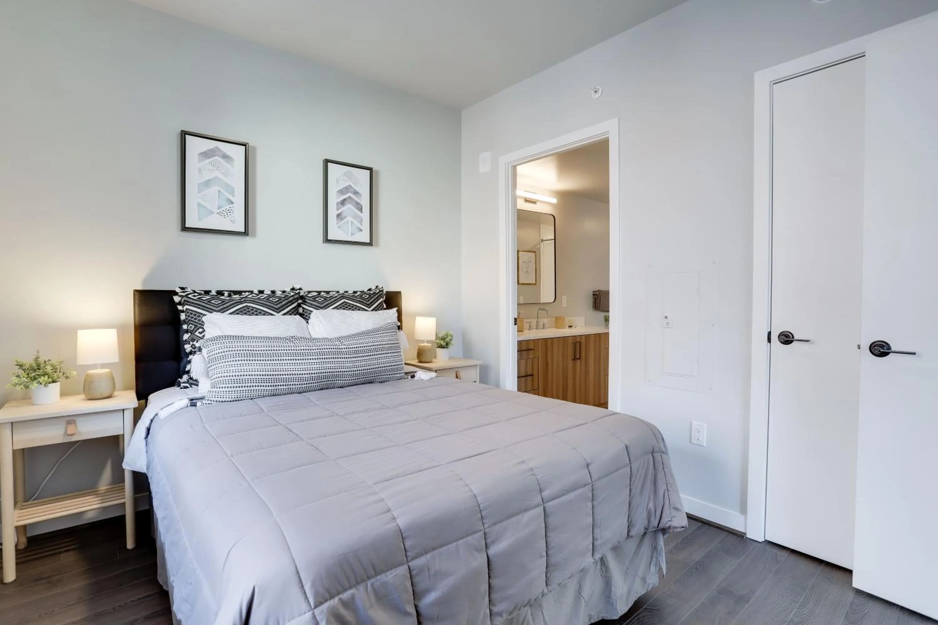Bed in Stylish Condo at Clarendon with Rooftop Views