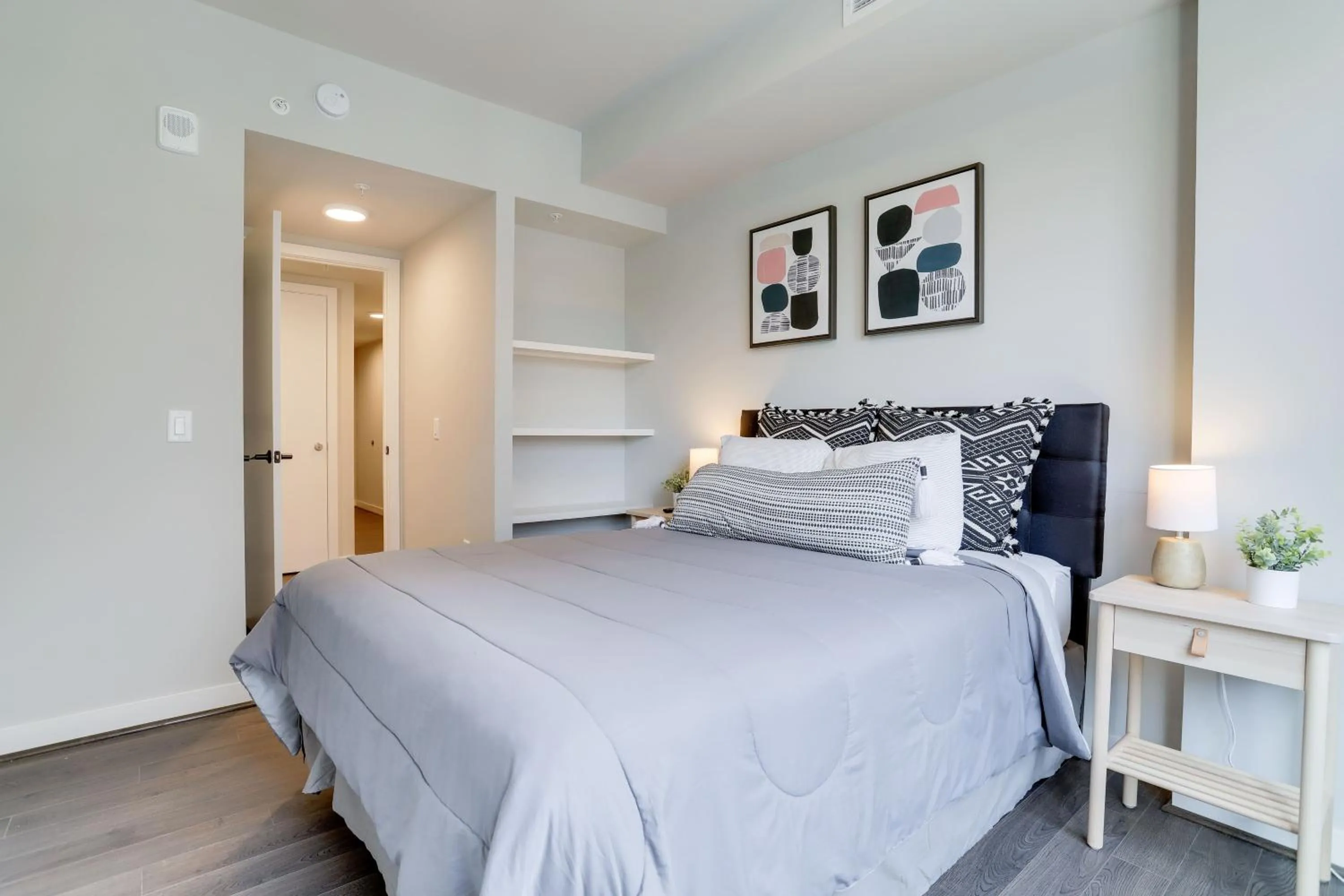 Bed in Stylish Condo at Clarendon with Rooftop Views