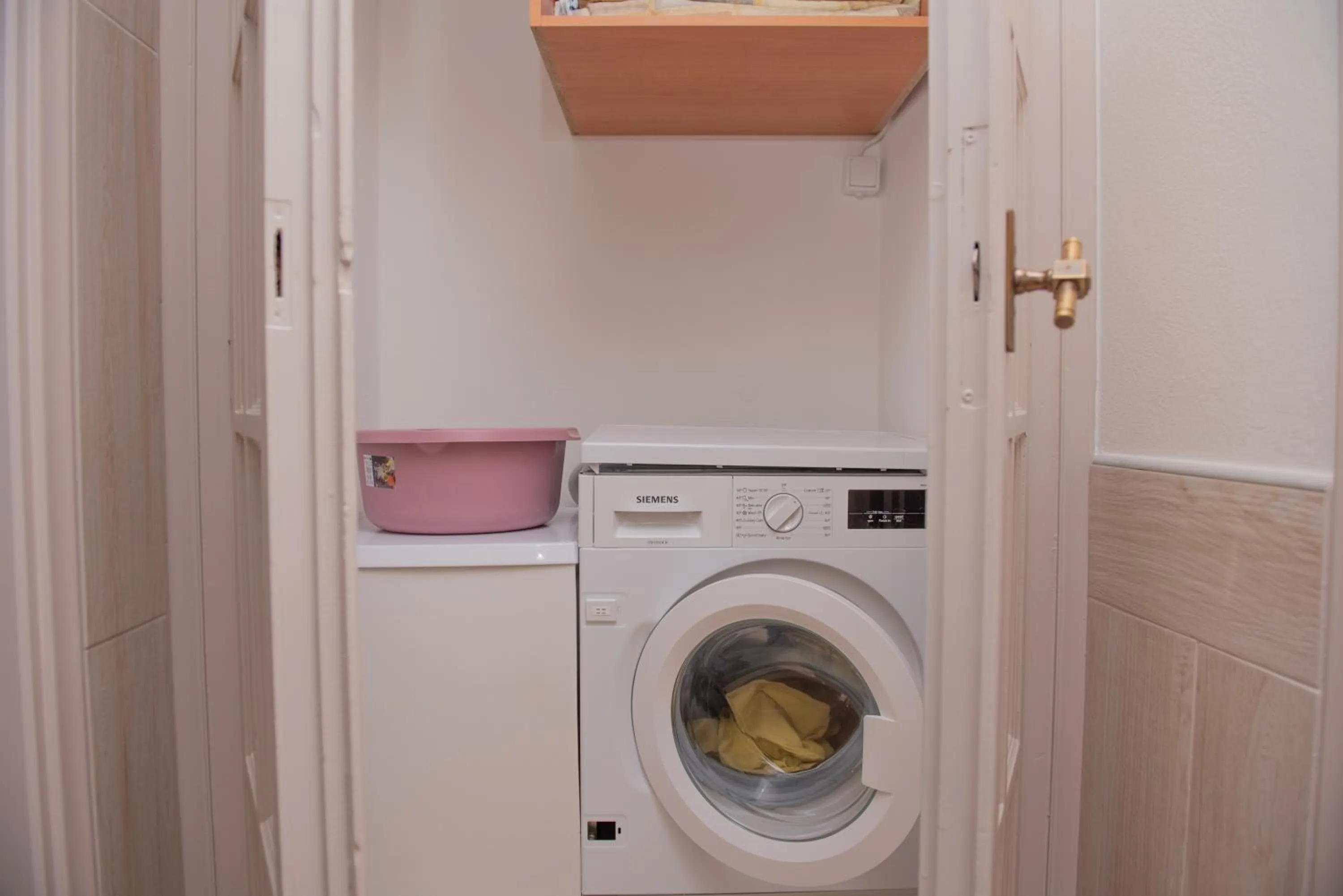 washing machine in Tsaner Apartment and Rooms