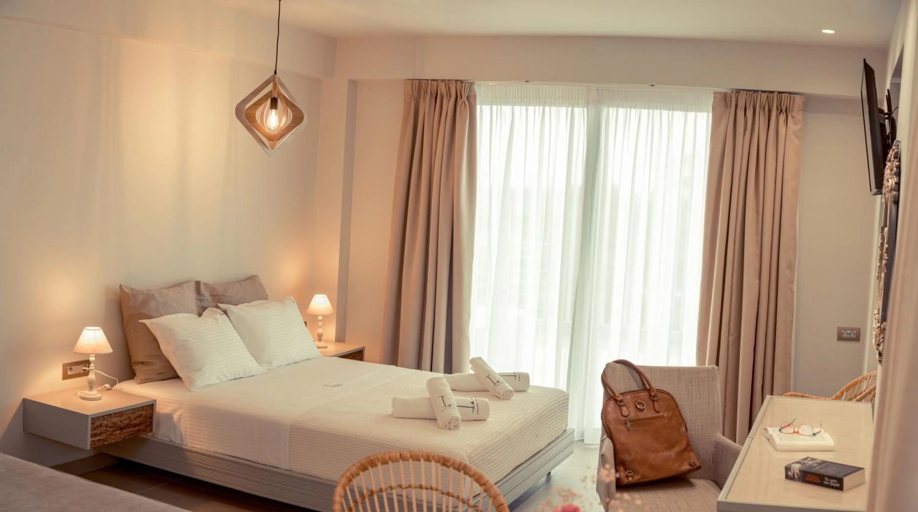 Bed in IO Luxury Pool & Hot Tub Suites