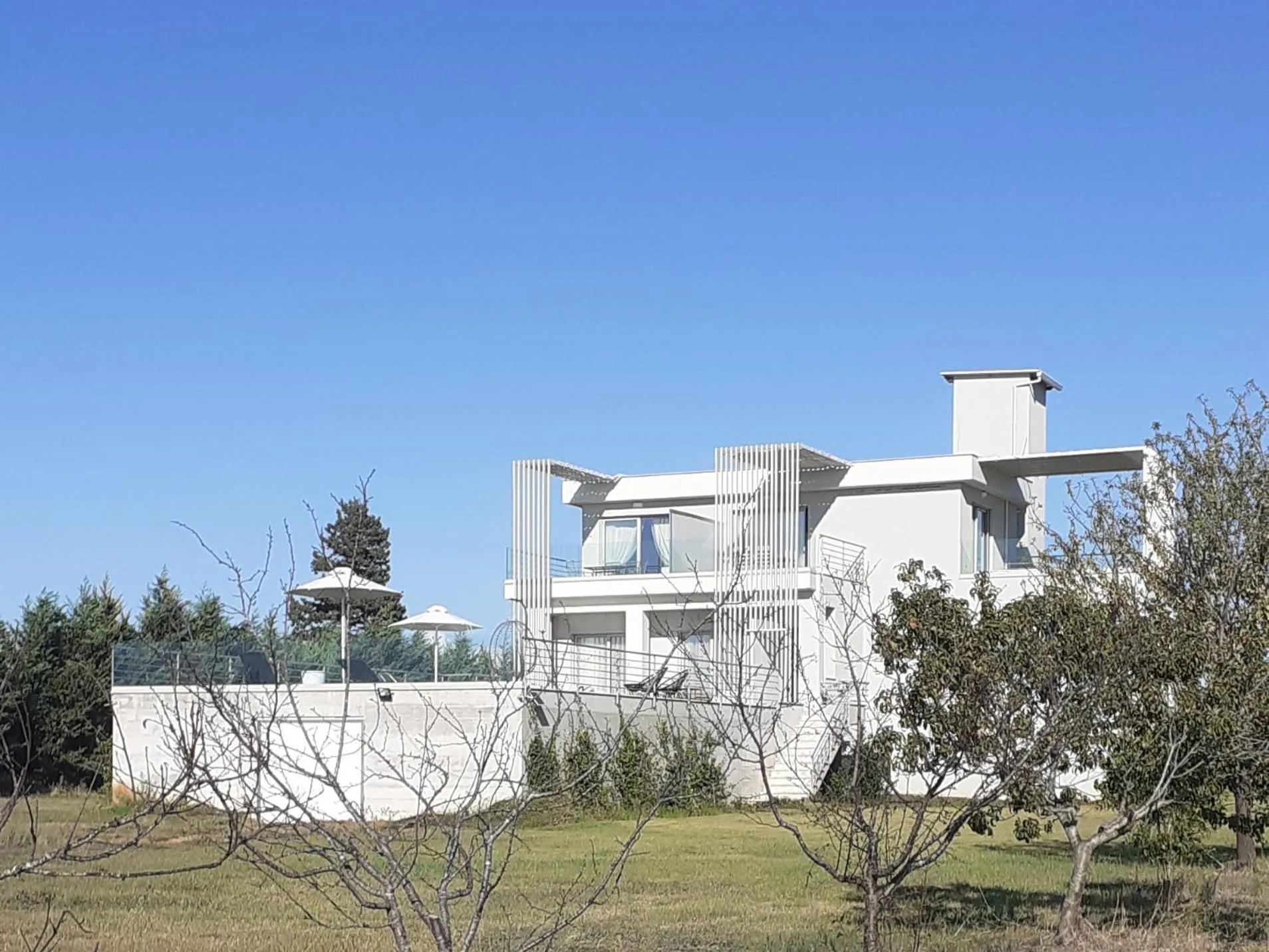 Property building in IO Luxury Pool & Hot Tub Suites