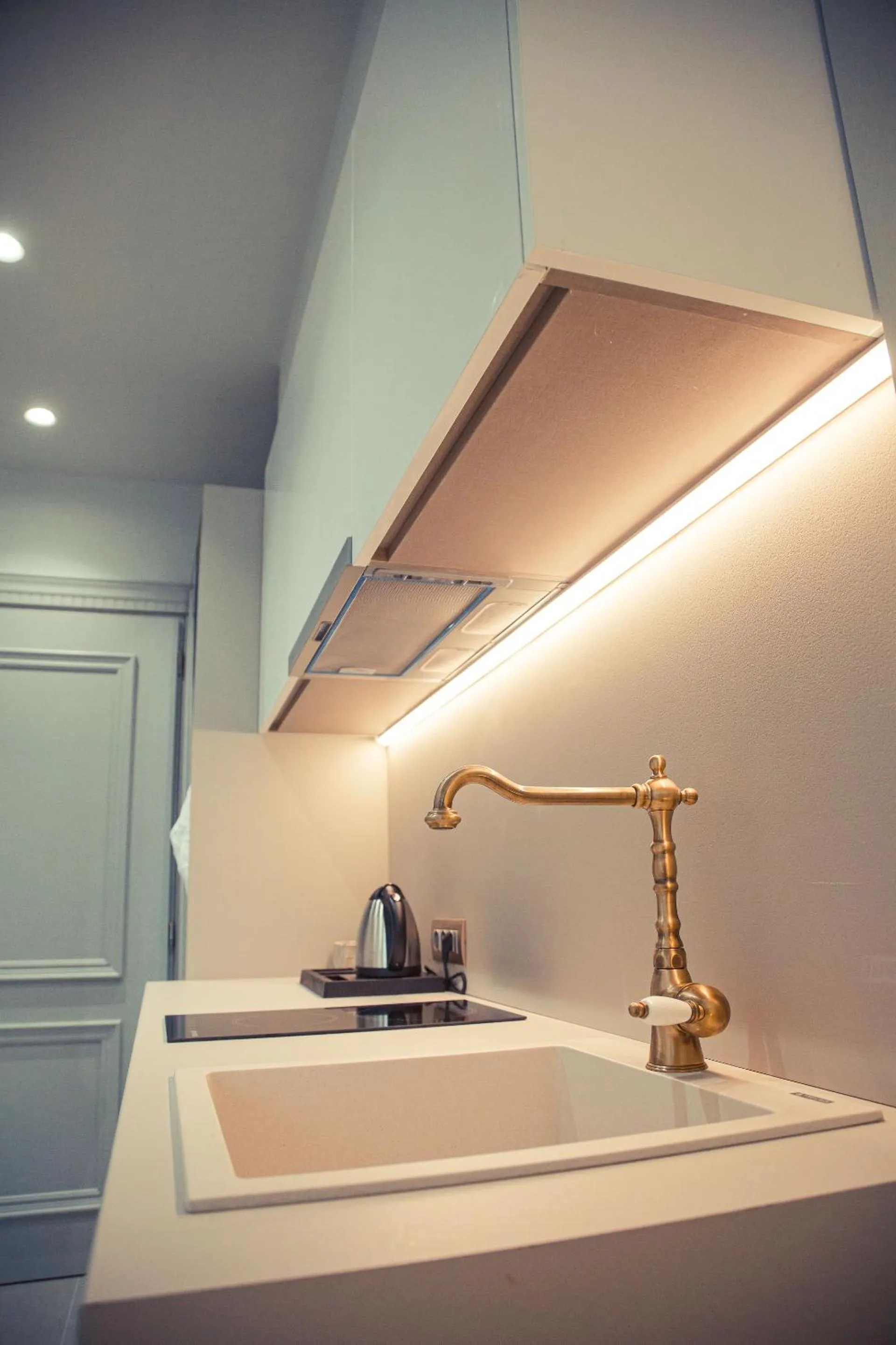 Kitchen or kitchenette in IO Luxury Pool & Hot Tub Suites