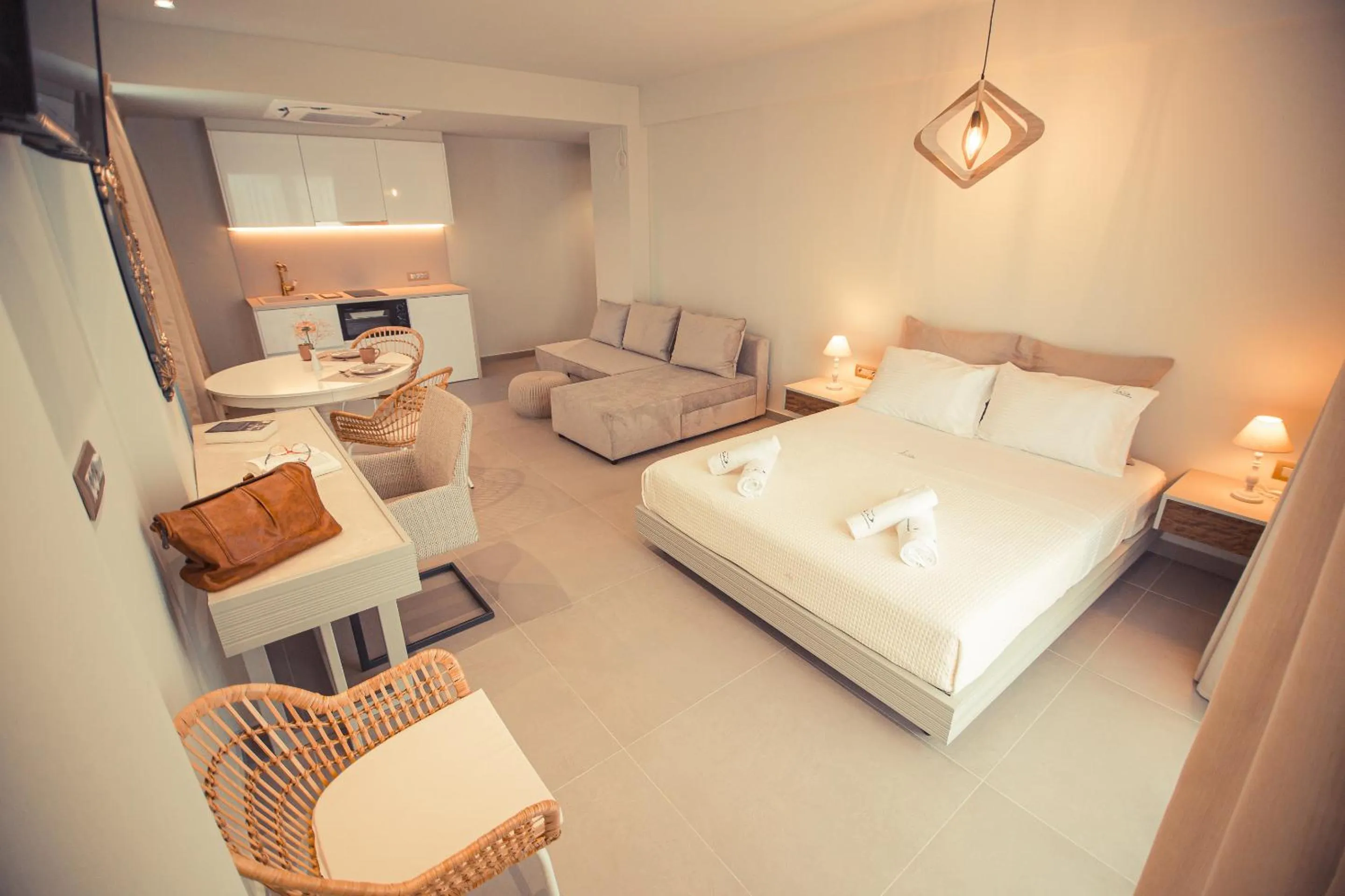 Bed in IO Luxury Pool & Hot Tub Suites