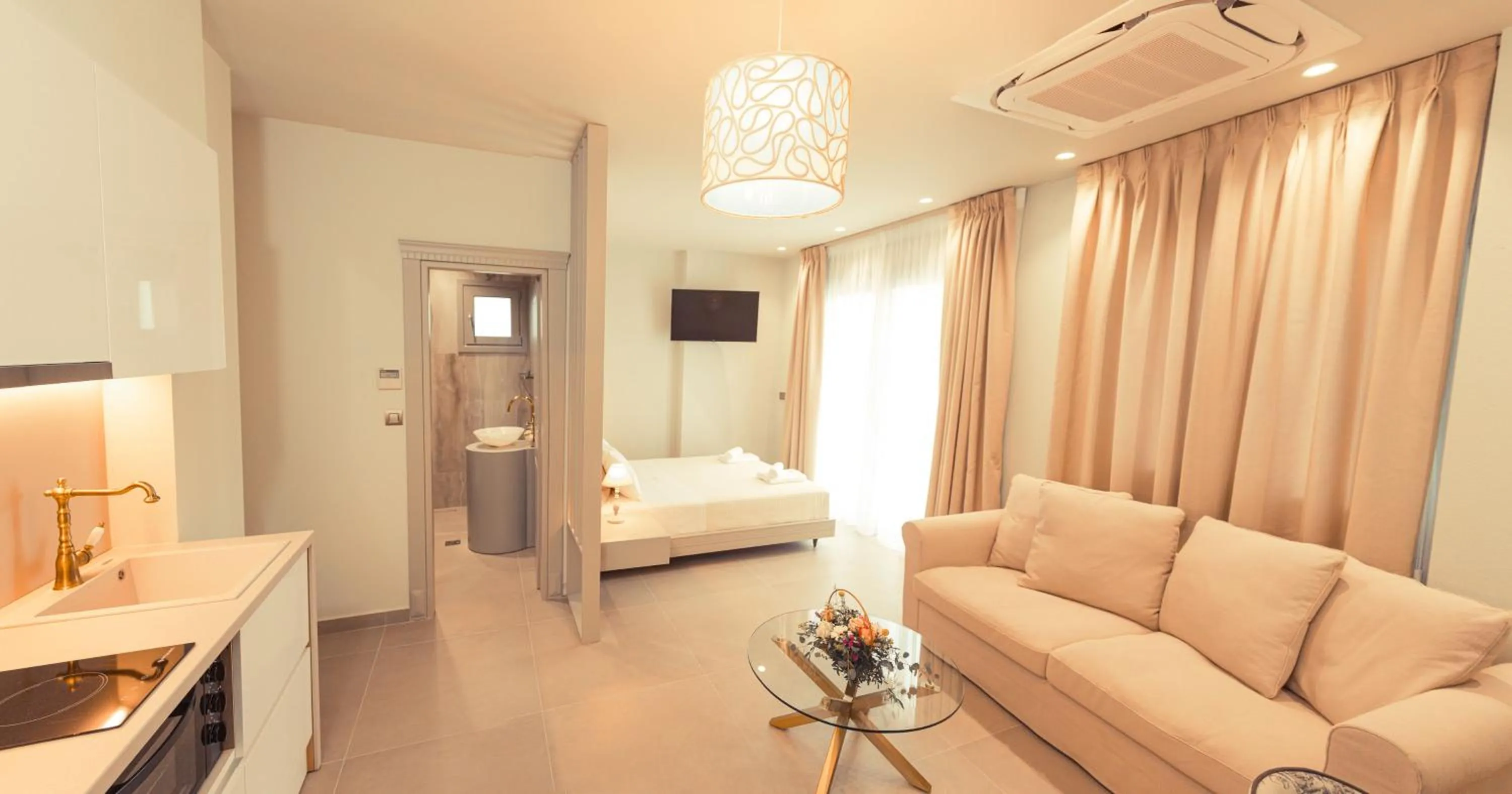 Bed in IO Luxury Pool & Hot Tub Suites