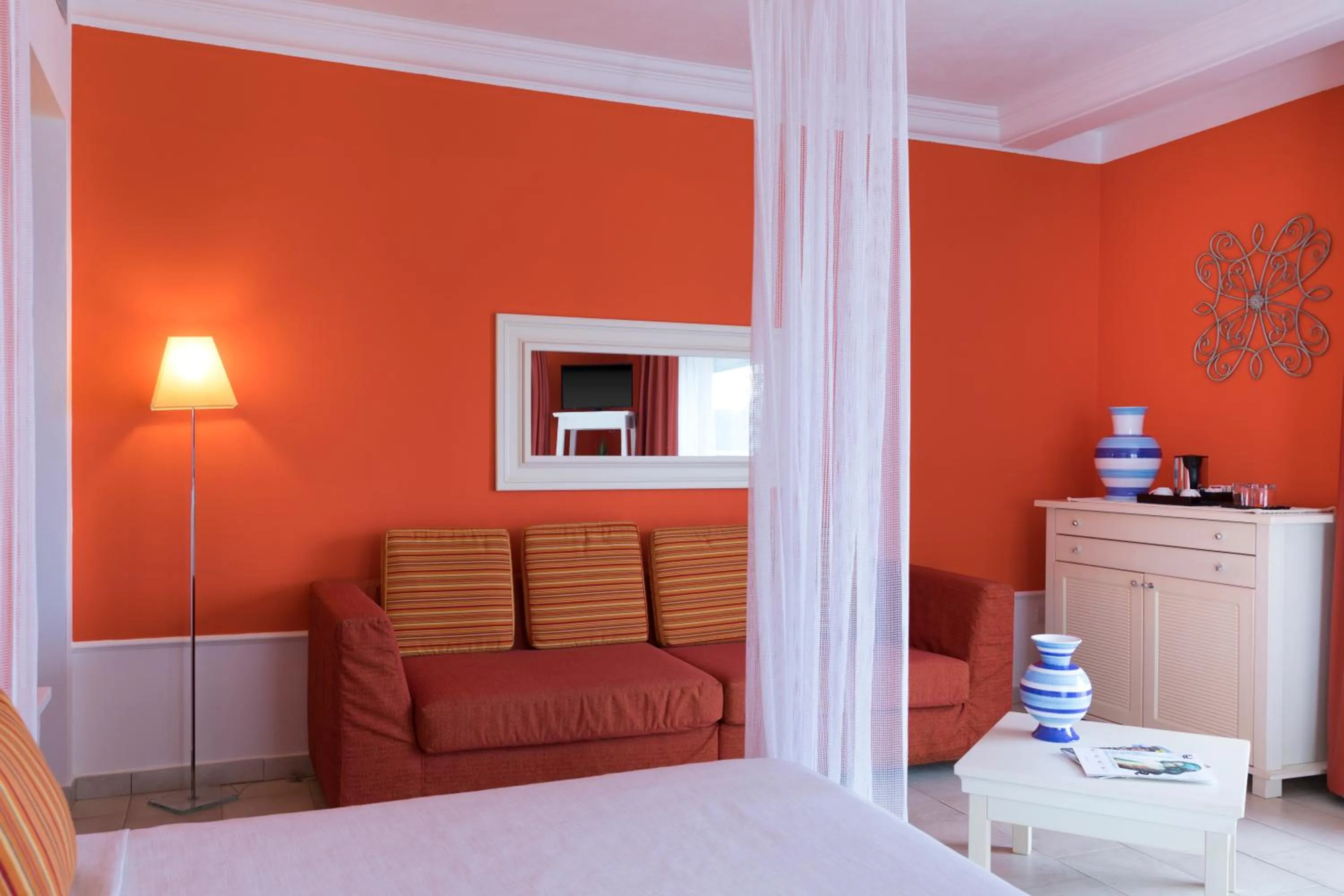 Seating area, Bed in Lu' Hotel Riviera - Carloforte