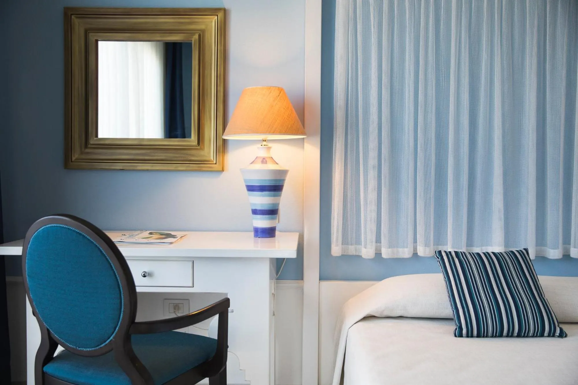 Seating area, Bed in Lu' Hotel Riviera - Carloforte