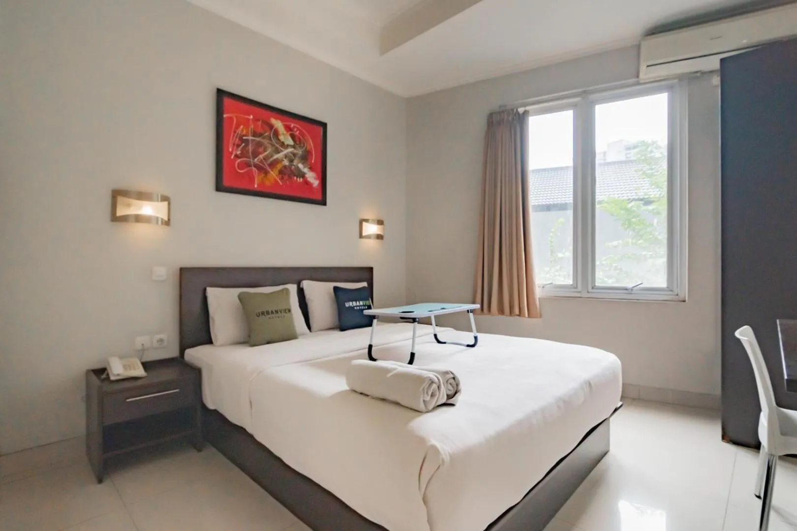 Photo of the whole room, Bed in Urbanview Hotel Grand Malabar Bandung