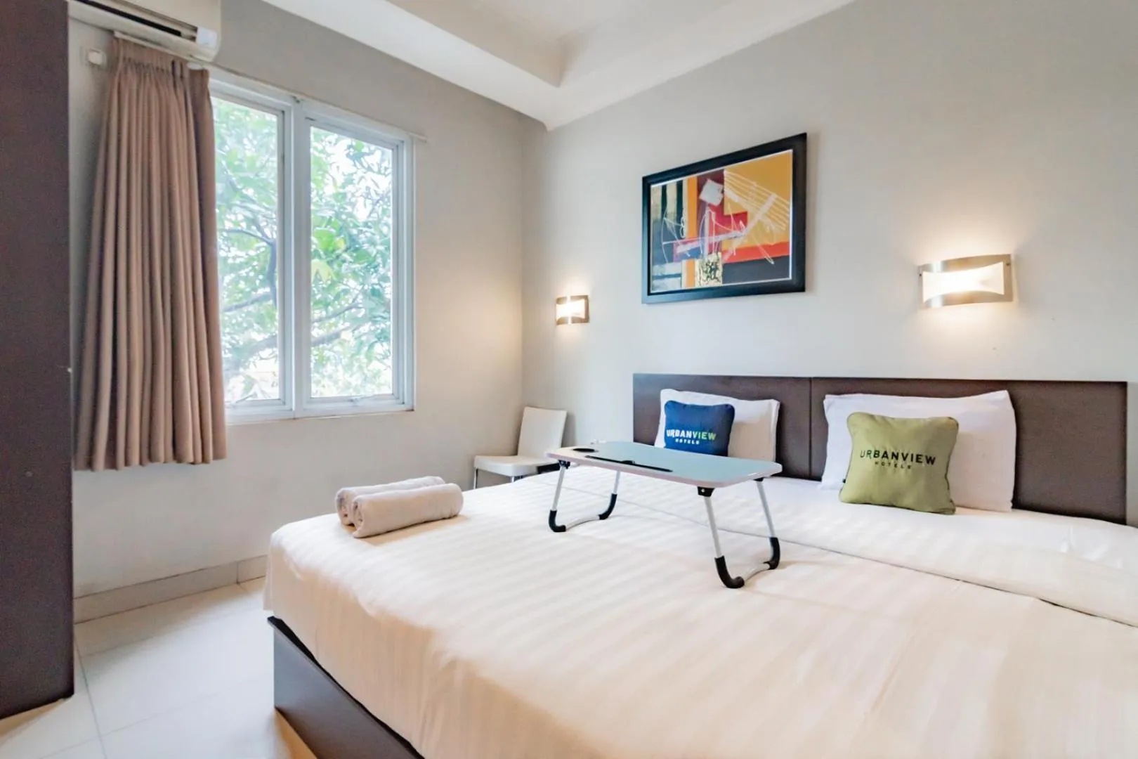 Photo of the whole room, Bed in Urbanview Hotel Grand Malabar Bandung