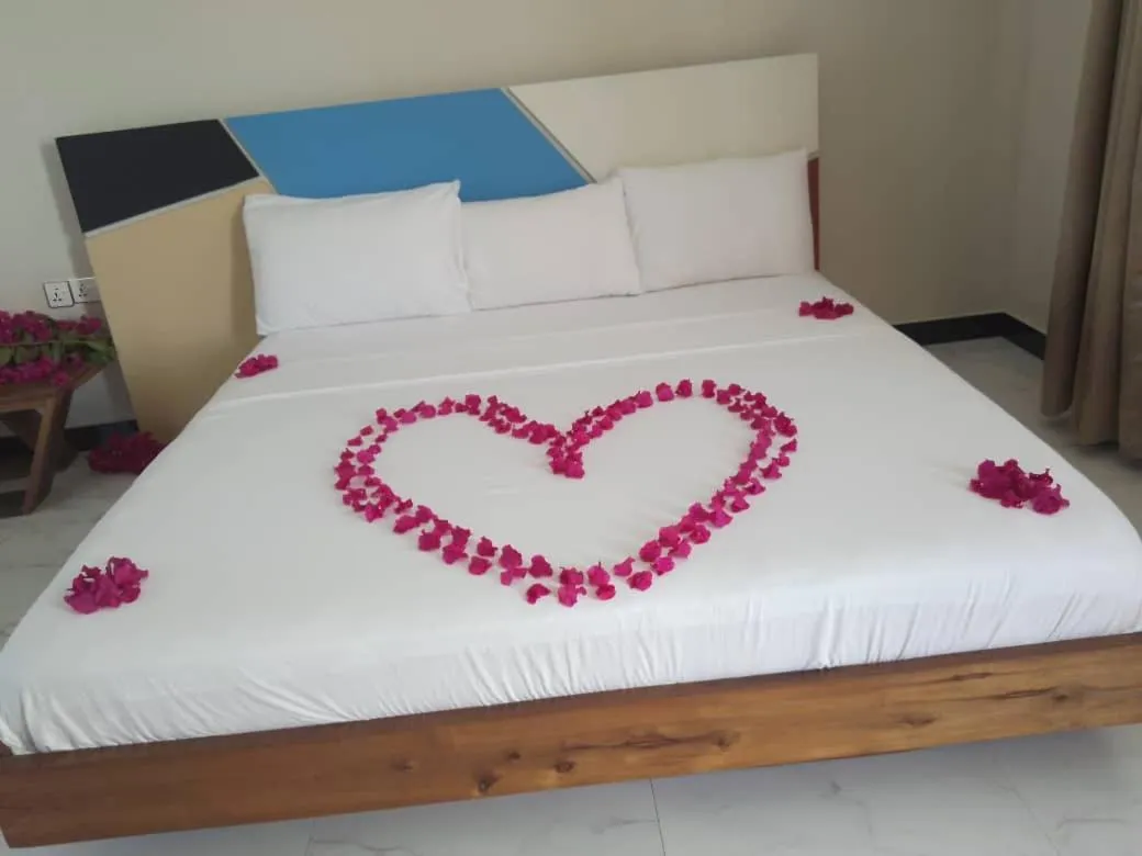 Bed in Ocean Breeze Hotel