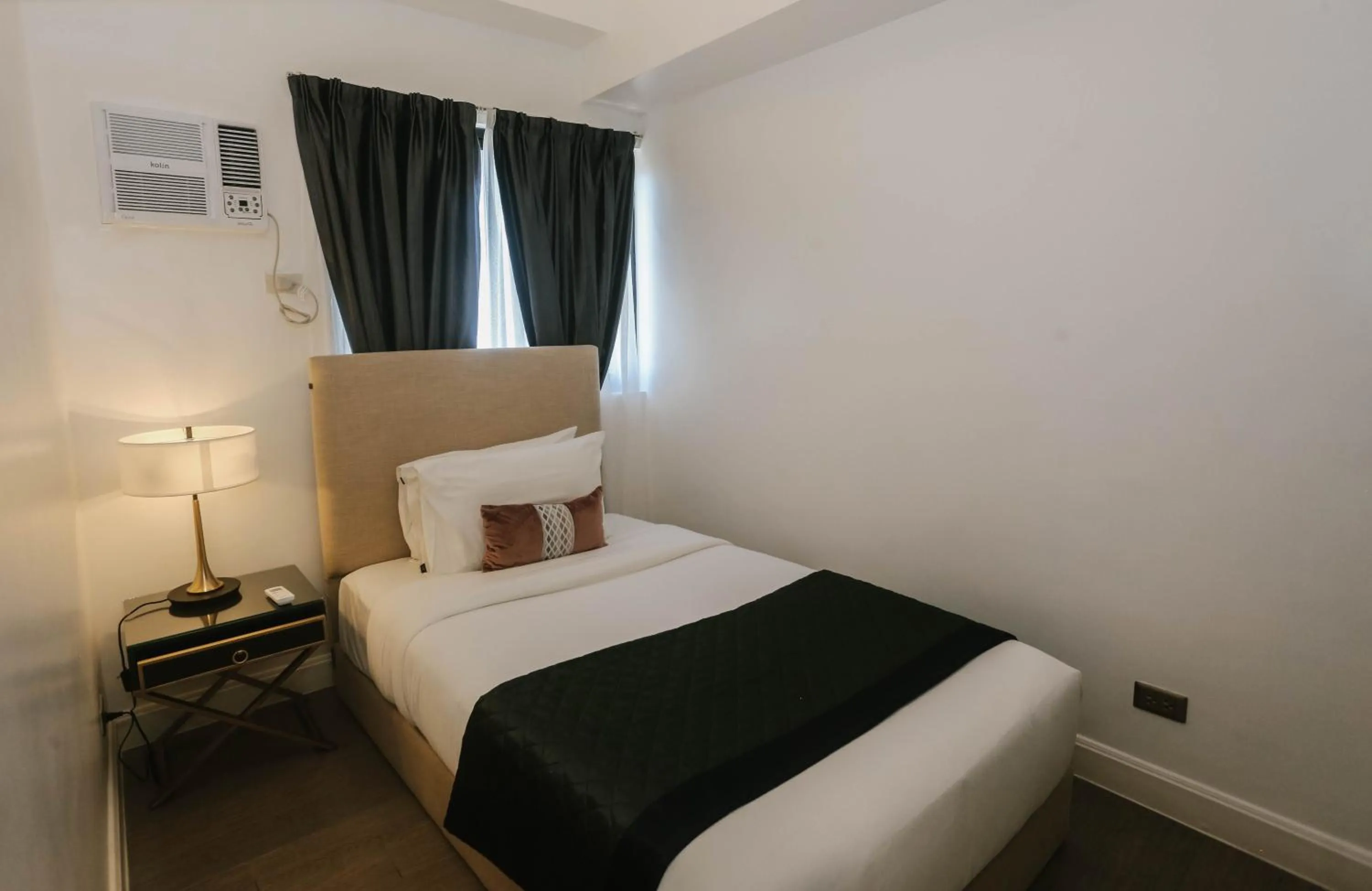 Bed in Noble Cebu Hotel