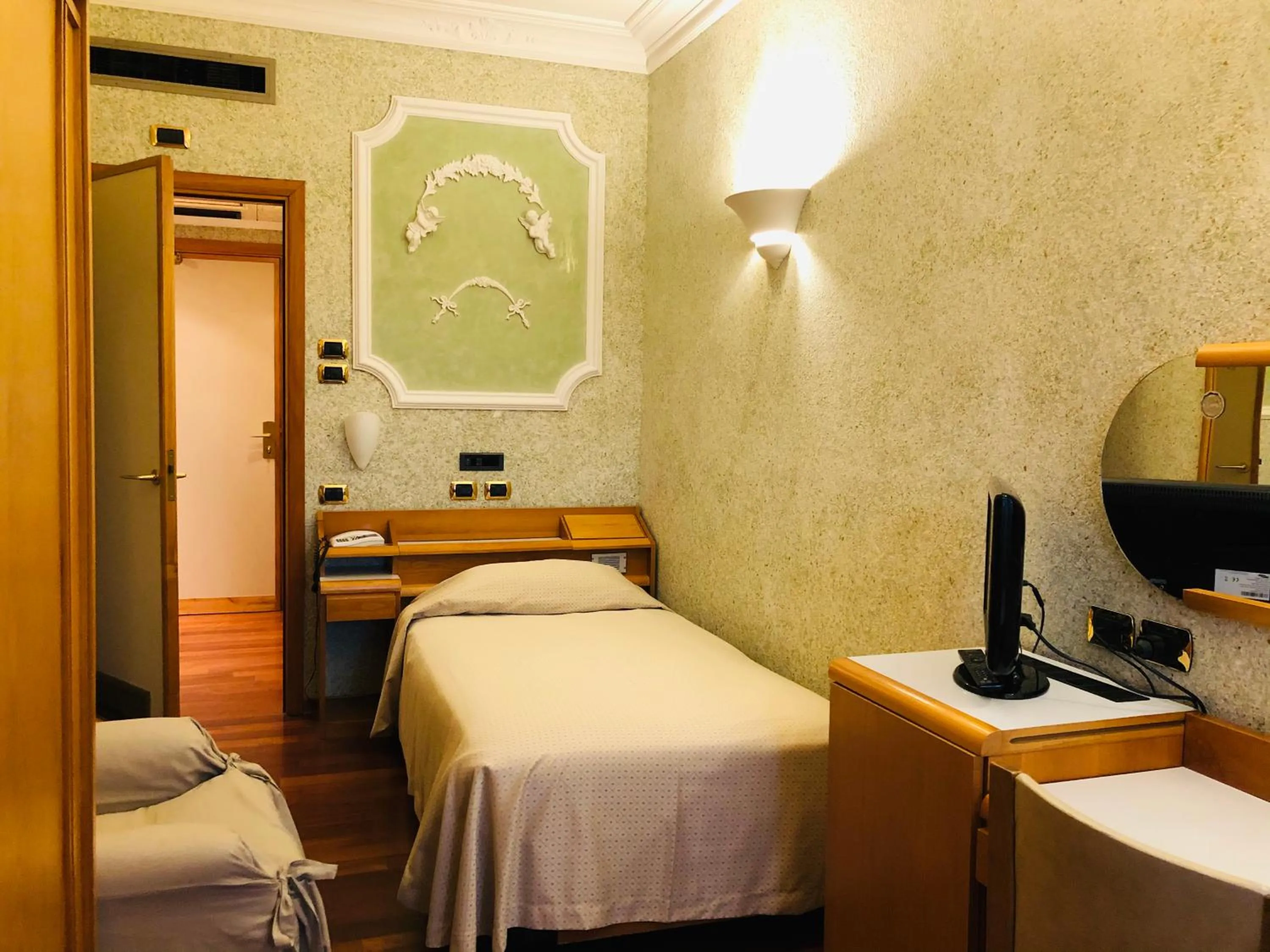 Bedroom in Grand Hotel Ambasciatori Wellness & Spa