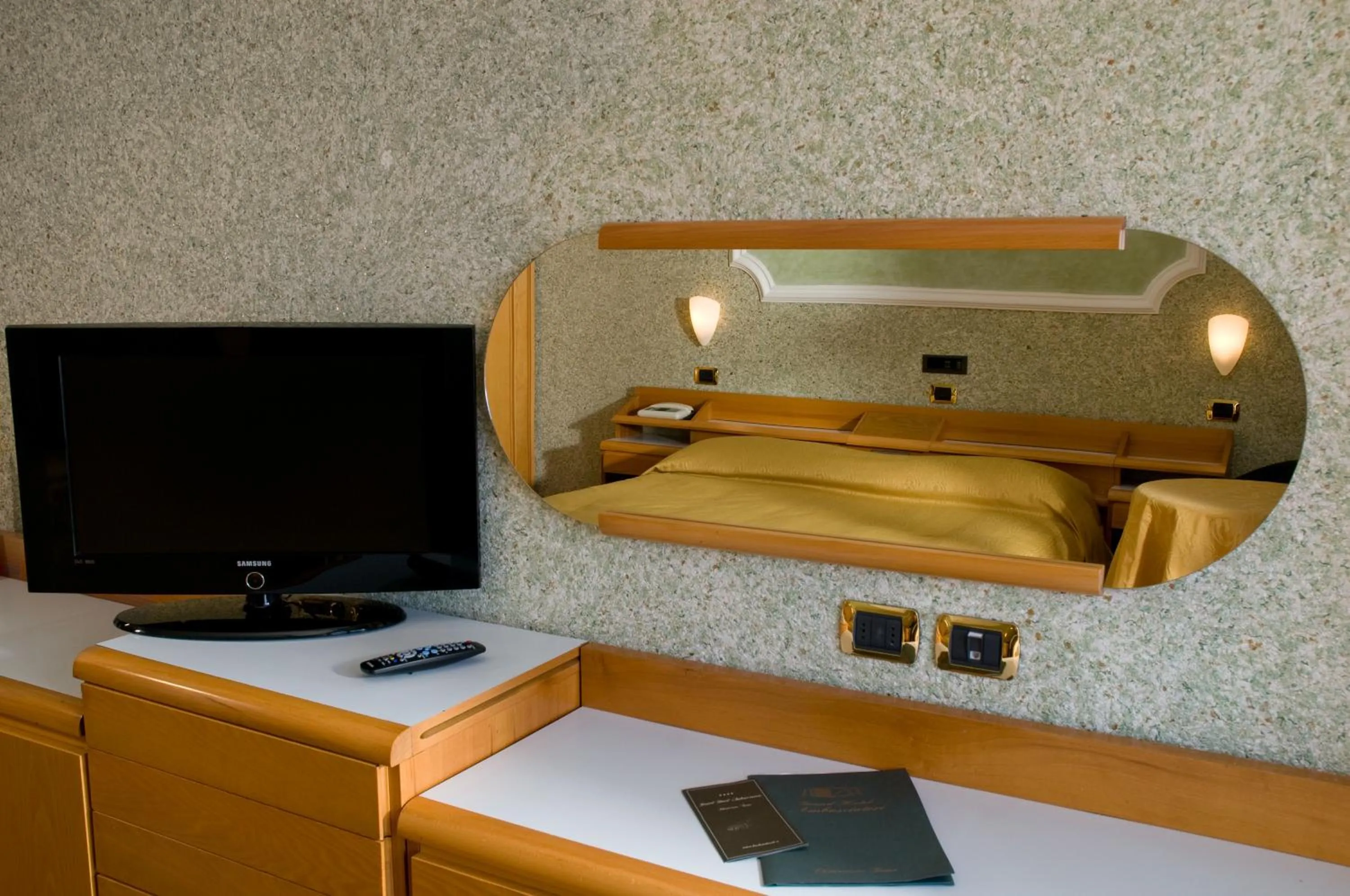 Bedroom in Grand Hotel Ambasciatori Wellness & Spa