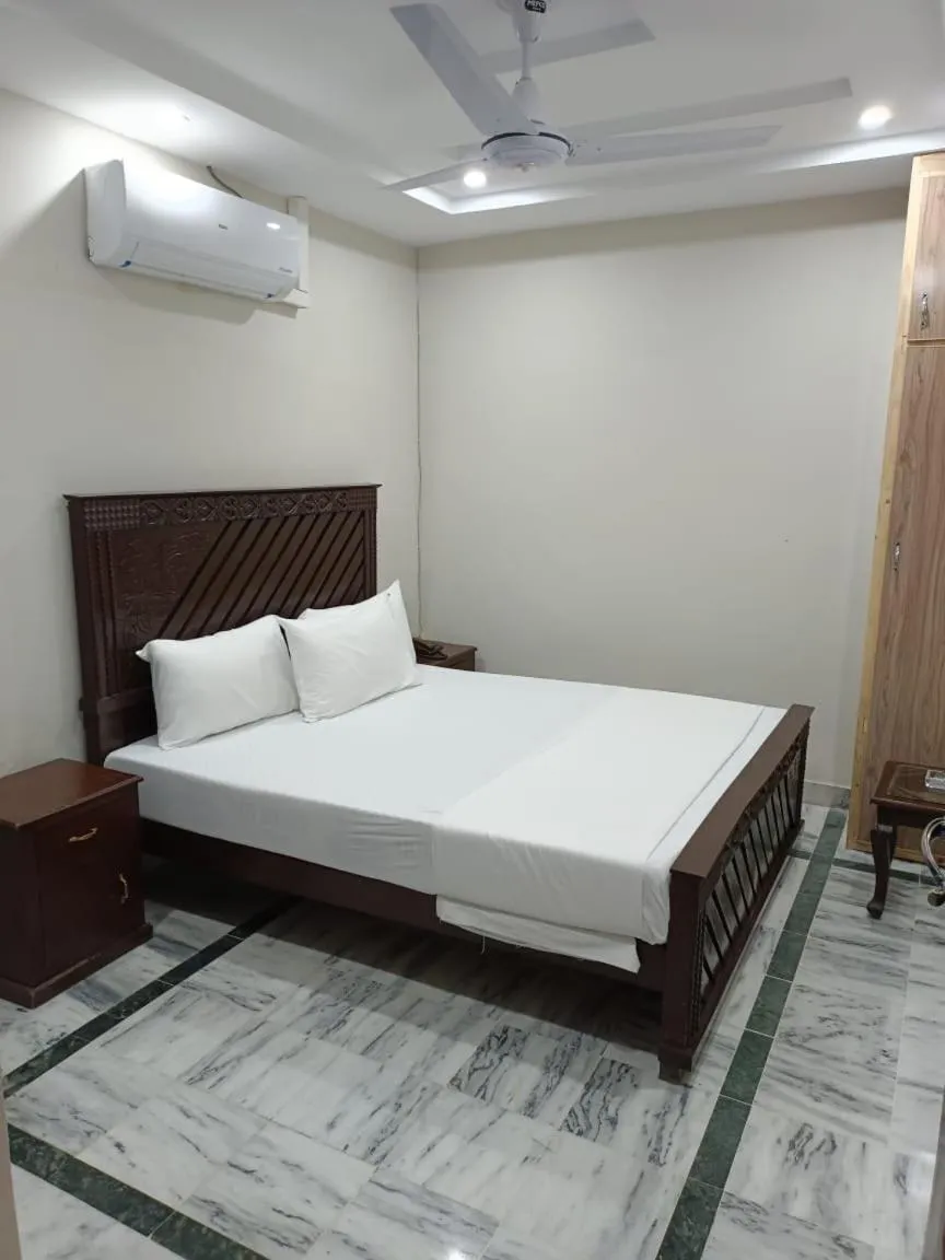 Bedroom in Royal Blue inn Hotel