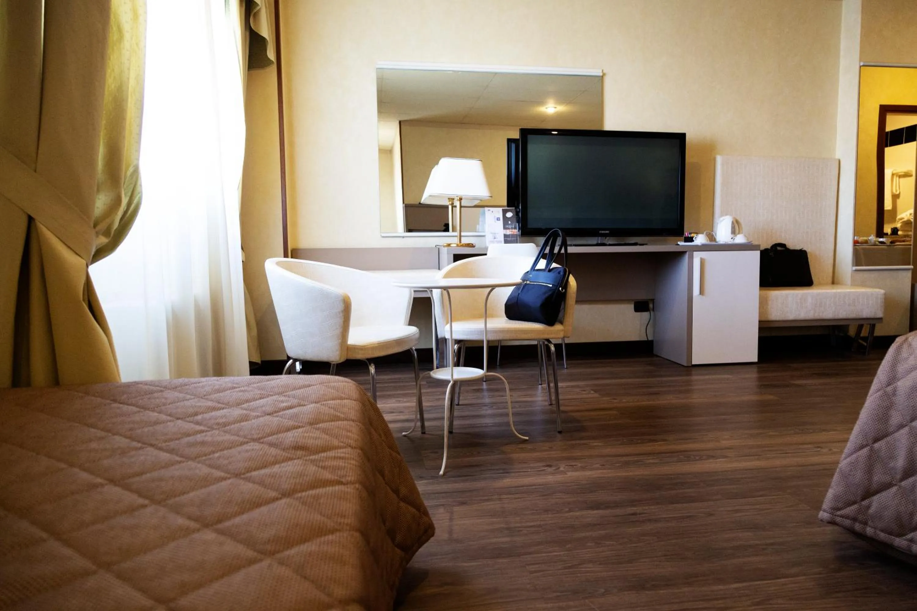 Living room, Bed in JR Hotels Bologna Amadeus