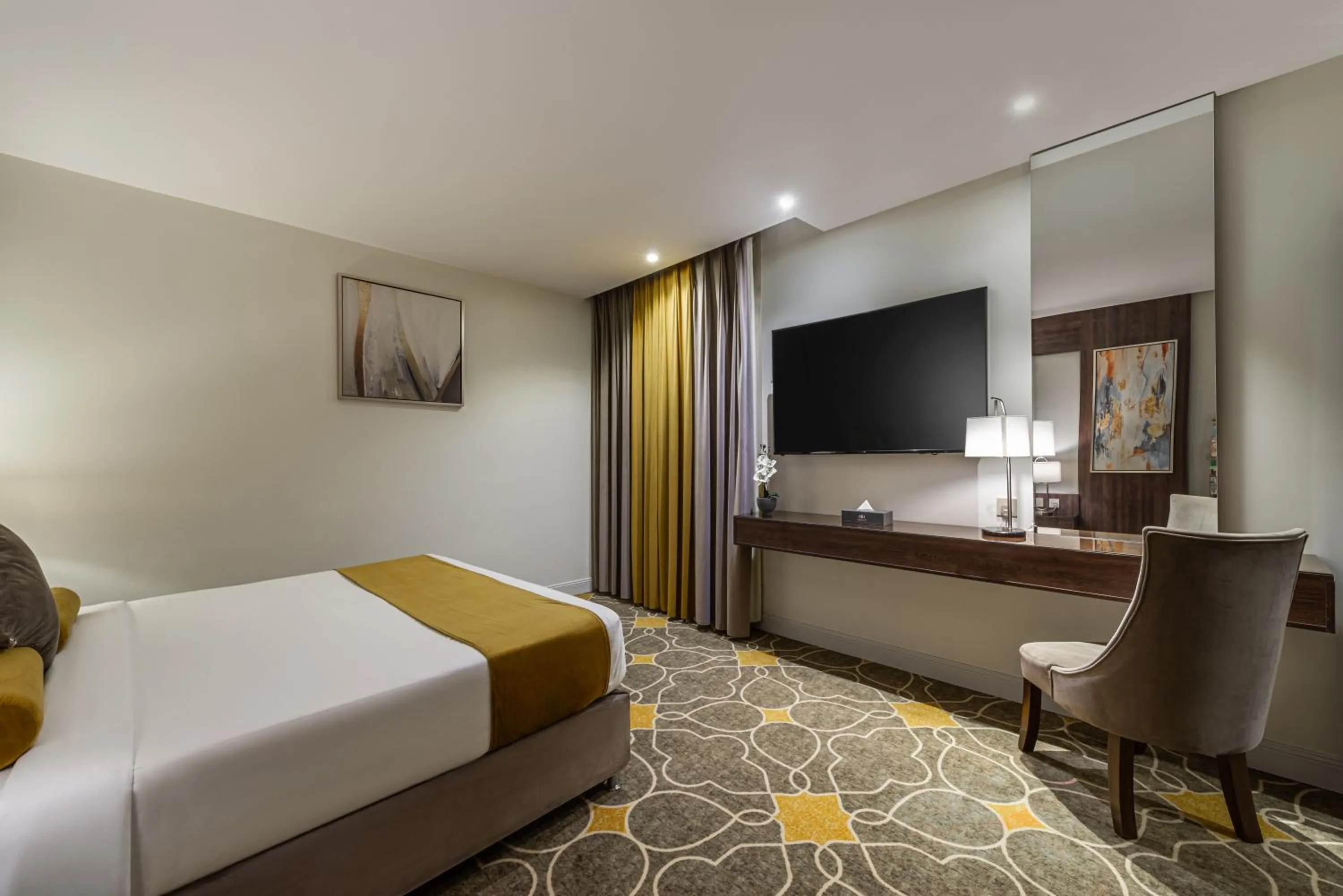 Bed in Abha Gardn Millennium Hotel