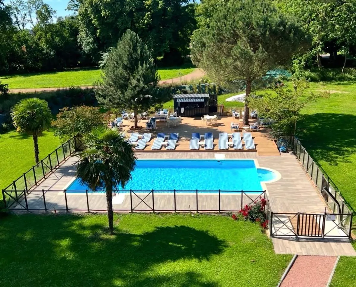 Swimming pool in Logis Hôtels Château de La Barge