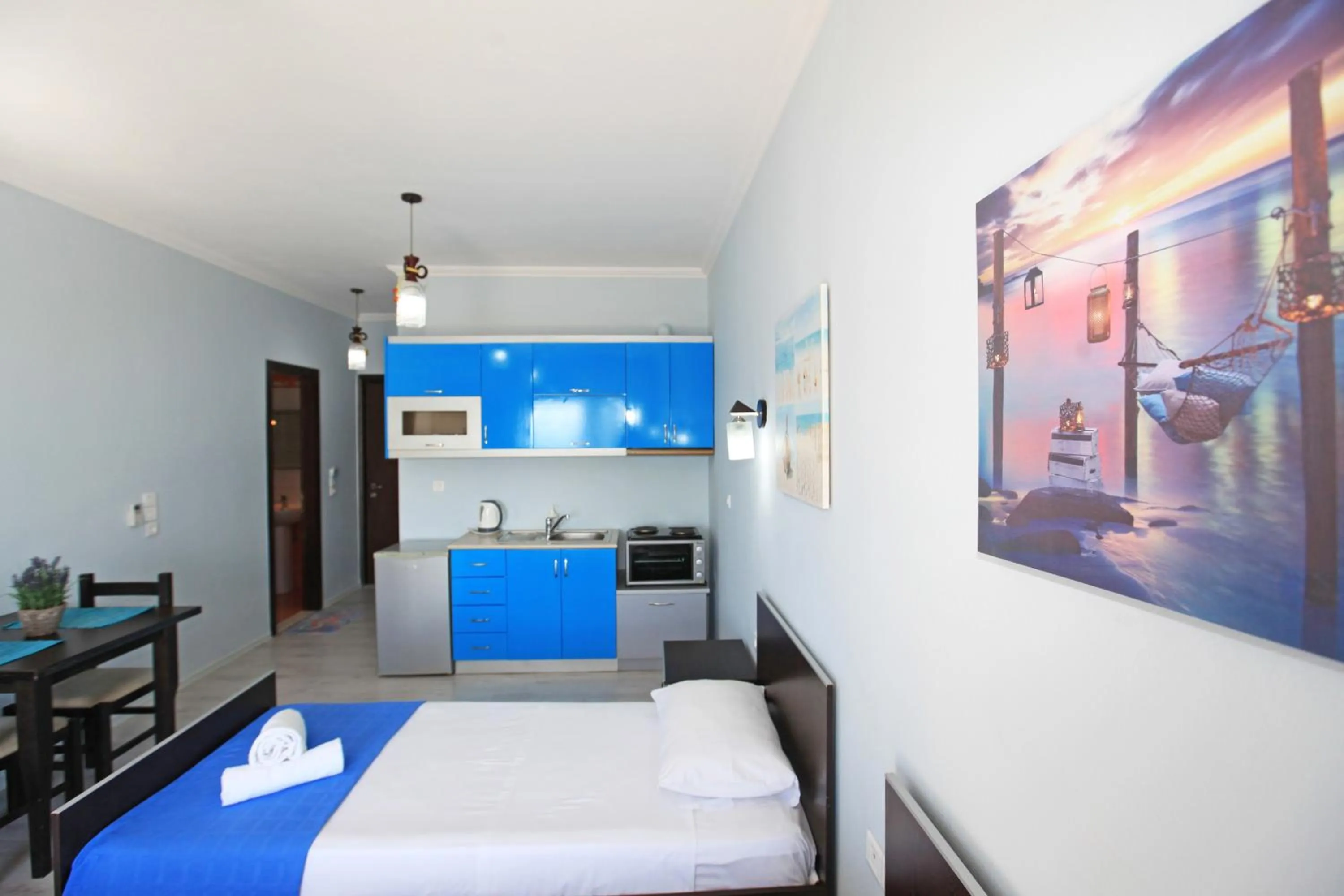 Kitchen or kitchenette, Bed in Keos Hotel