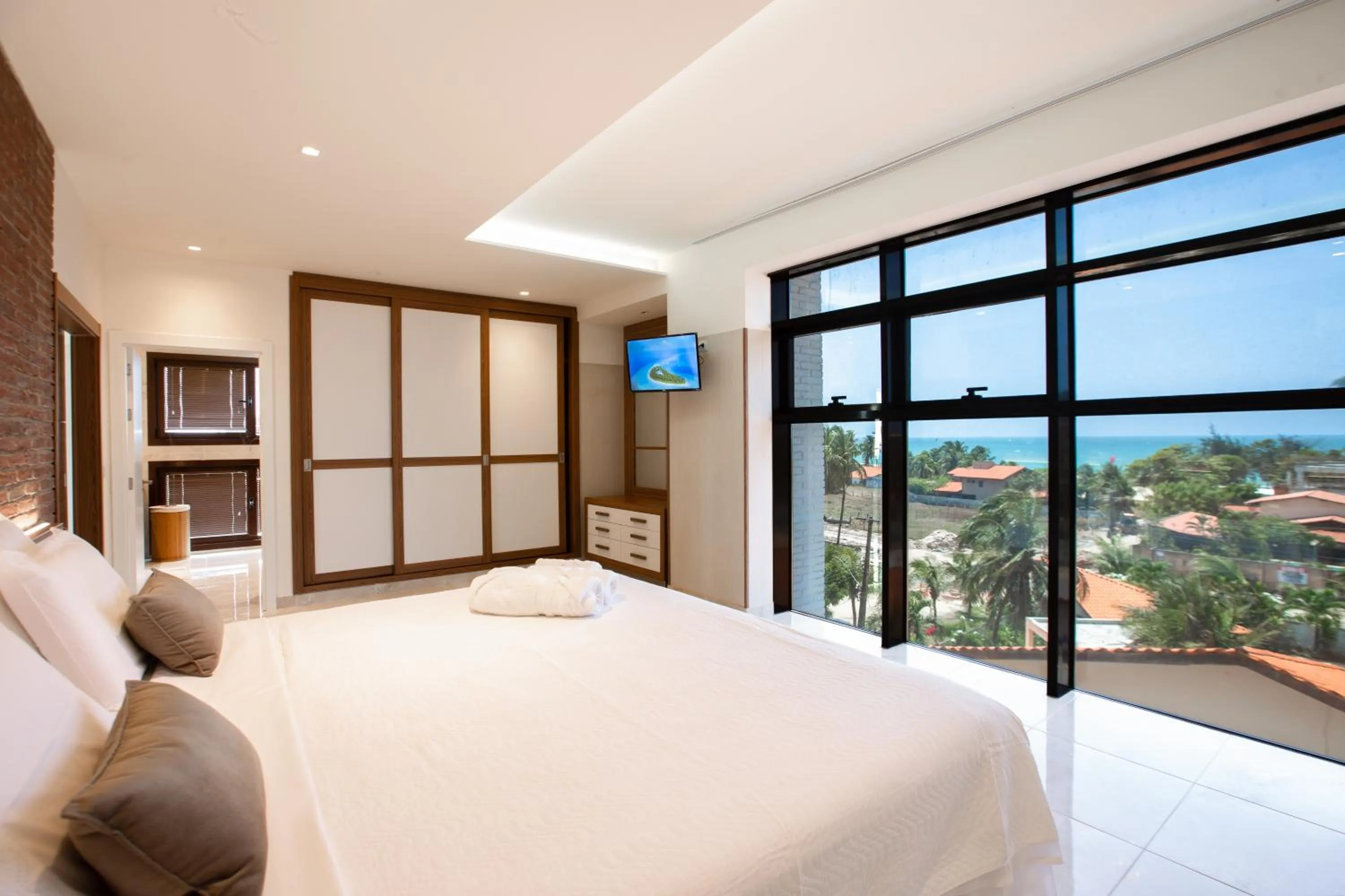 Communal lounge/ TV room, Bed in VM Hotel Cumbuco