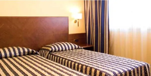 Bed in Hotel Marconi