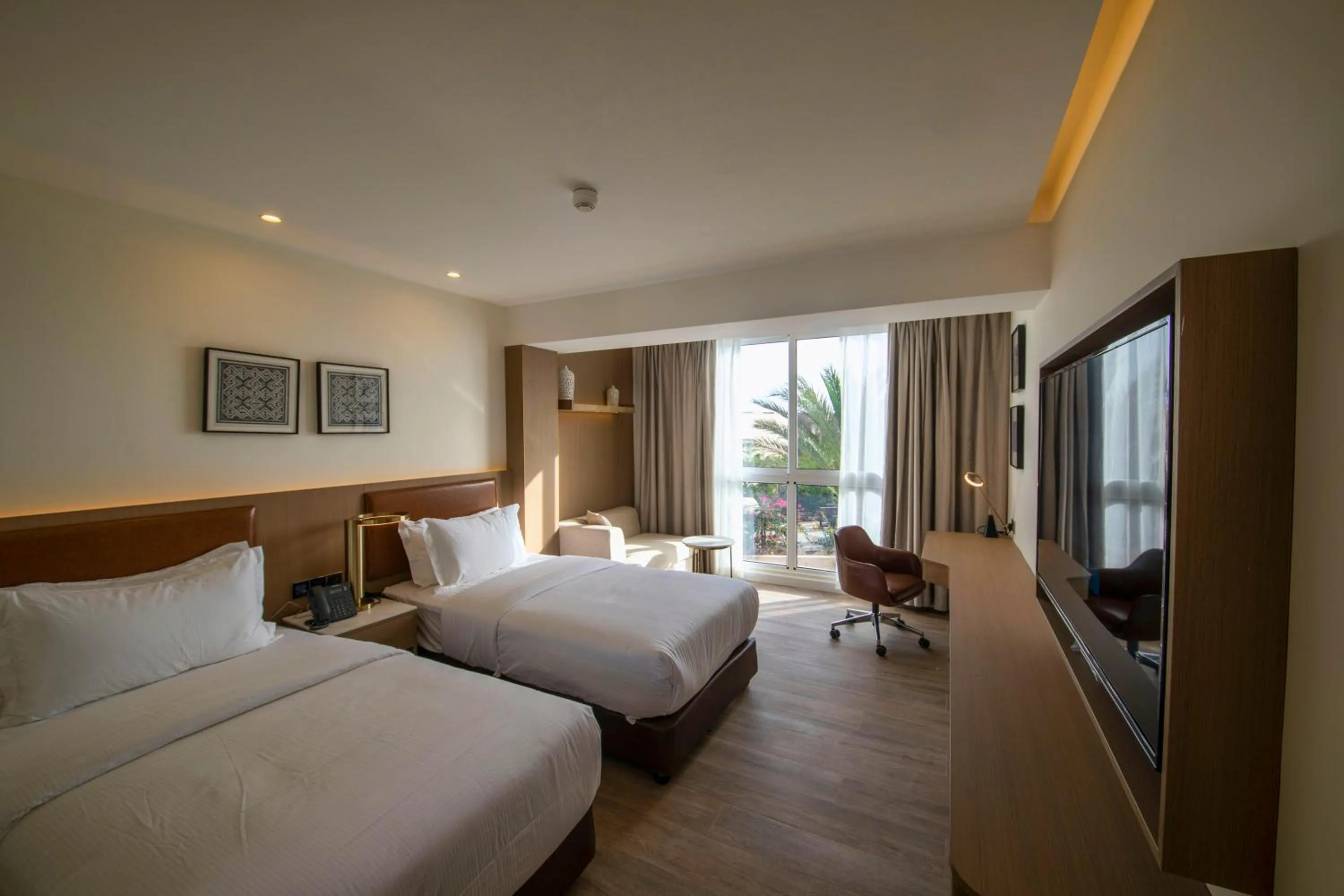 Photo of the whole room, Bed in Luxotel Aqaba Beach Resort & Spa Only 15 years plus