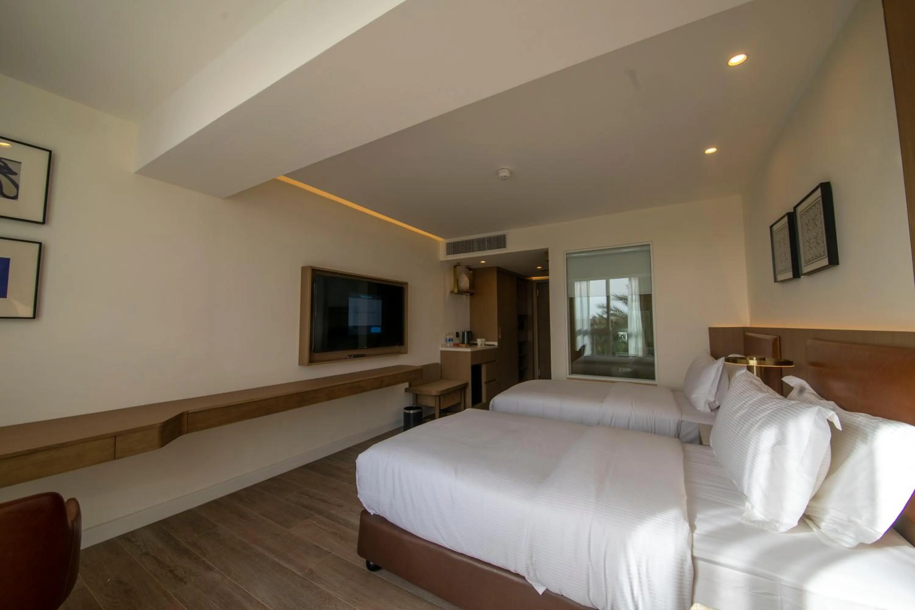 Photo of the whole room, Bed in Luxotel Aqaba Beach Resort & Spa Only 15 years plus