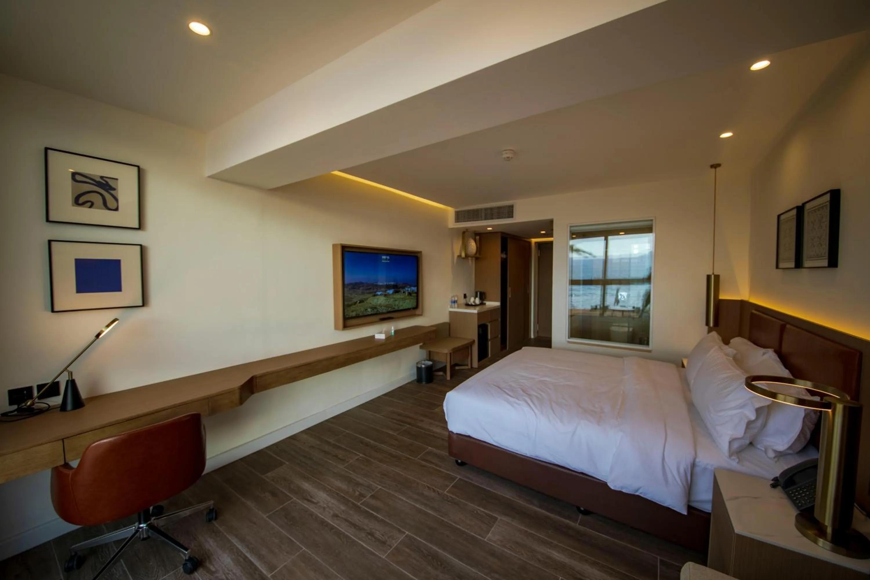 Photo of the whole room, Bed in Luxotel Aqaba Beach Resort & Spa Only 15 years plus