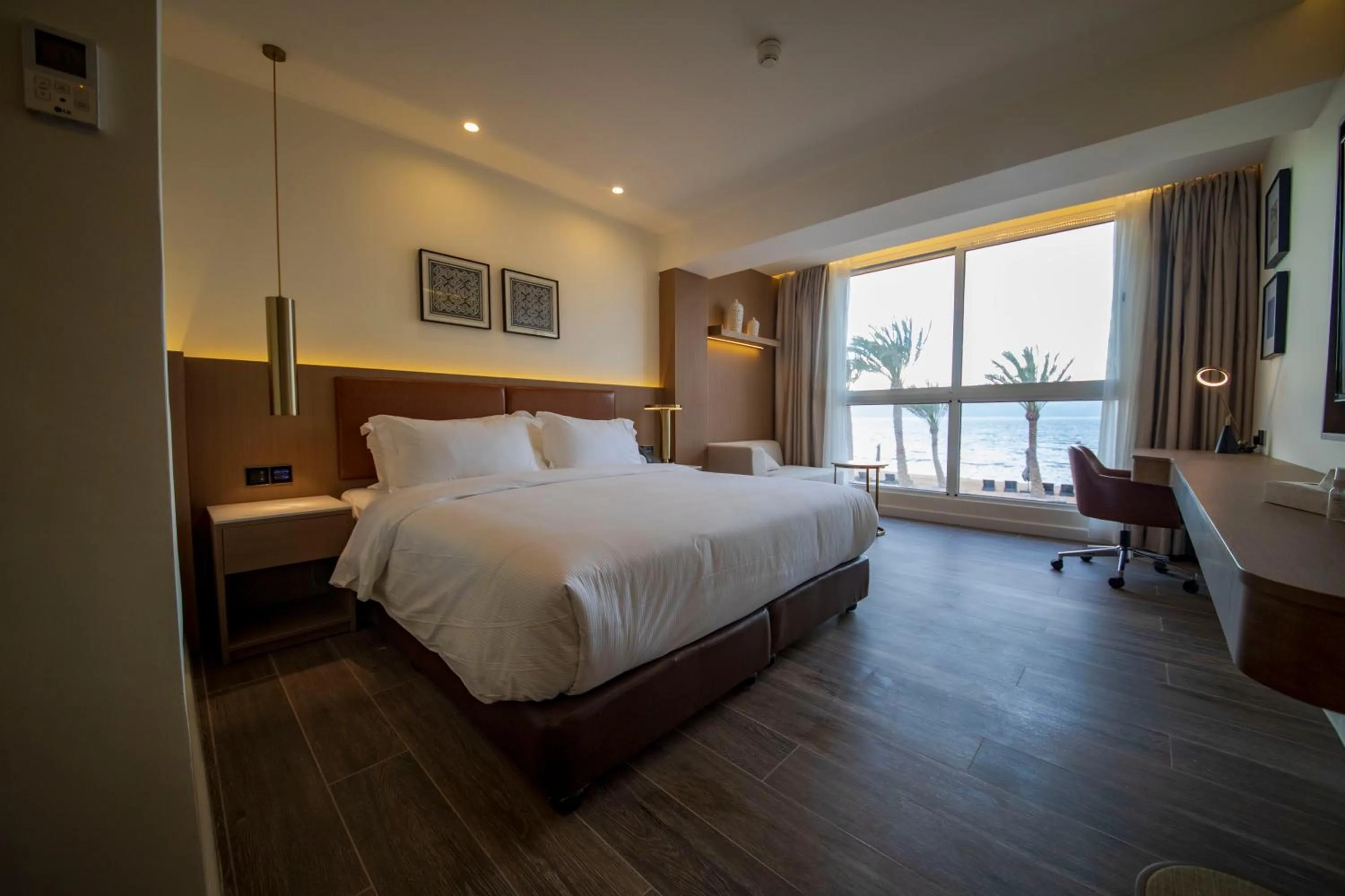 Photo of the whole room, Bed in Luxotel Aqaba Beach Resort & Spa Only 15 years plus