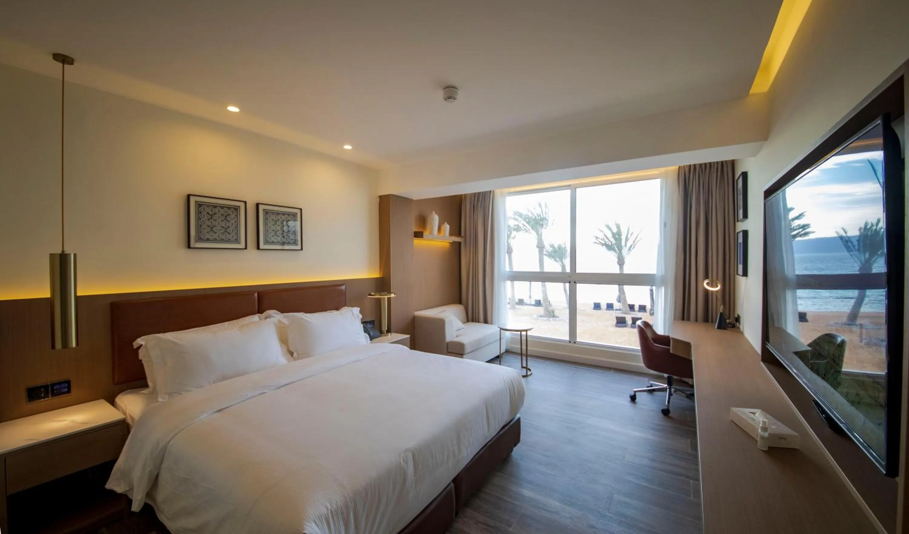 Photo of the whole room, Bed in Luxotel Aqaba Beach Resort & Spa Only 15 years plus