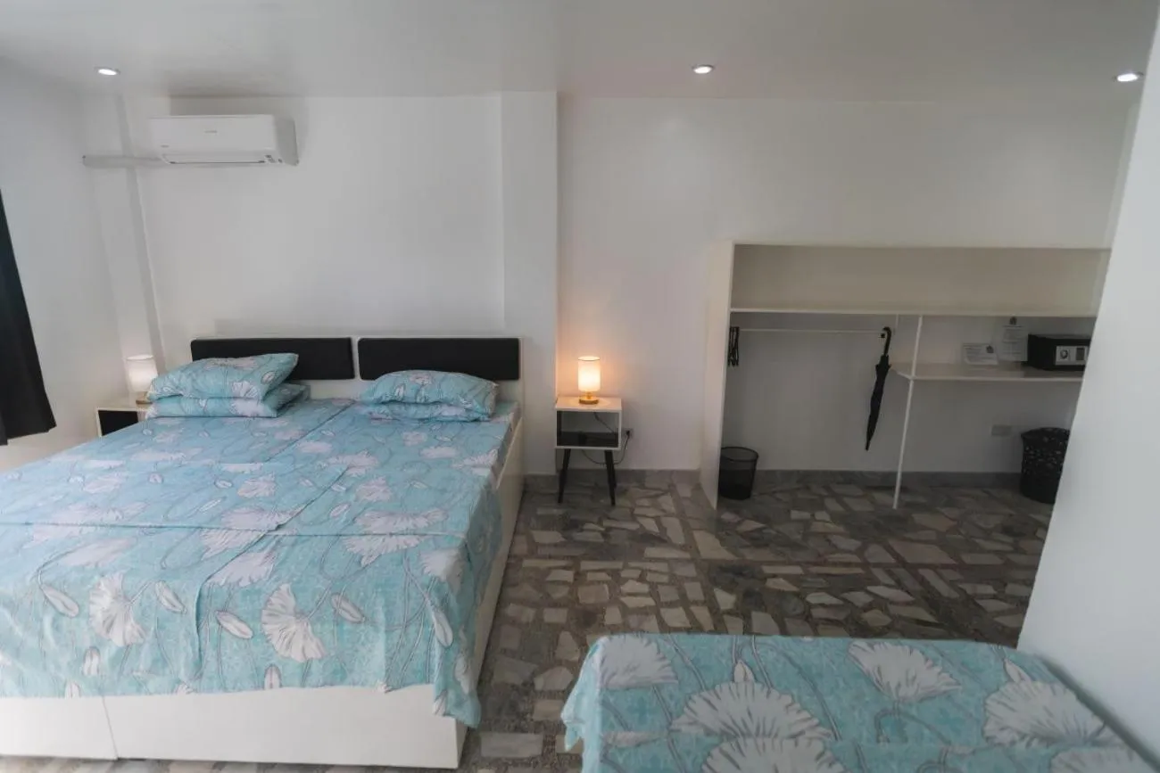 Photo of the whole room, Bed in The Three P Beach Resort & Dive Center