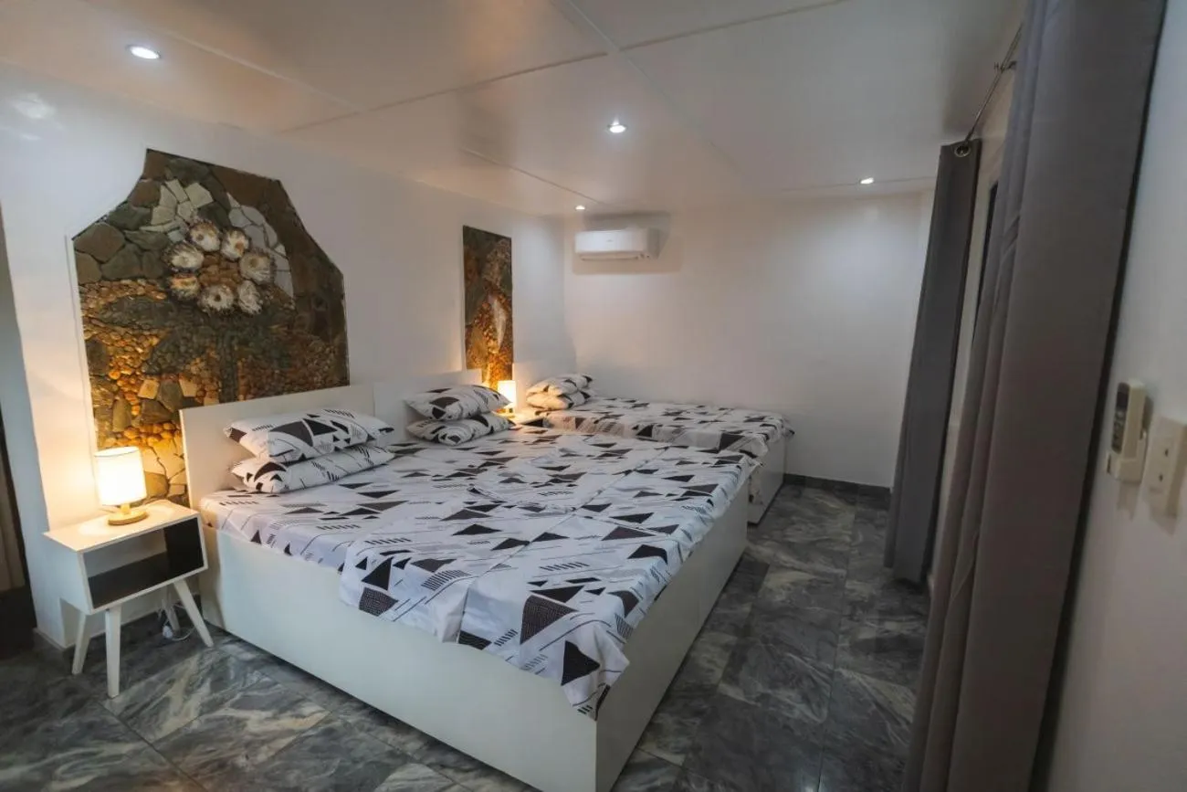 Bed in The Three P Beach Resort & Dive Center