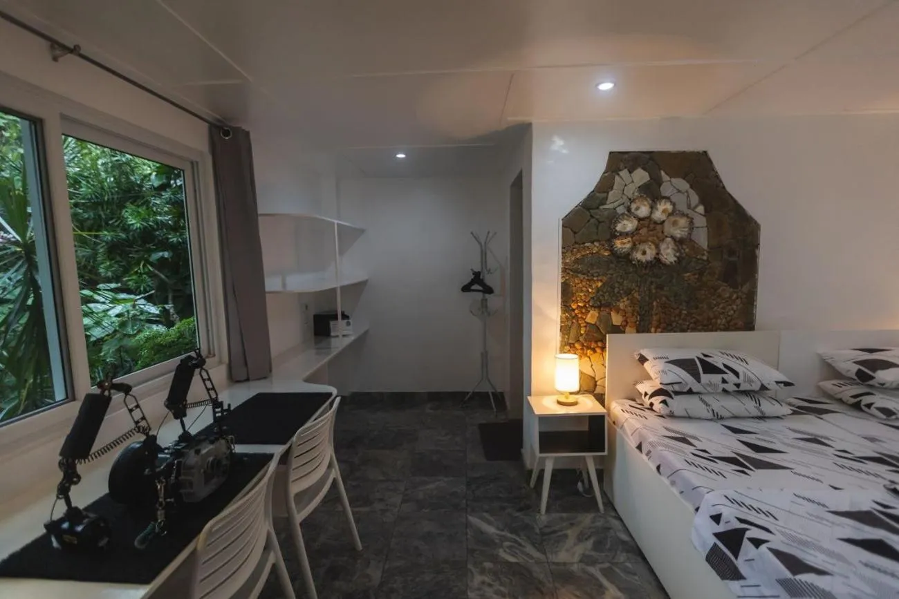 Photo of the whole room, Bed in The Three P Beach Resort & Dive Center