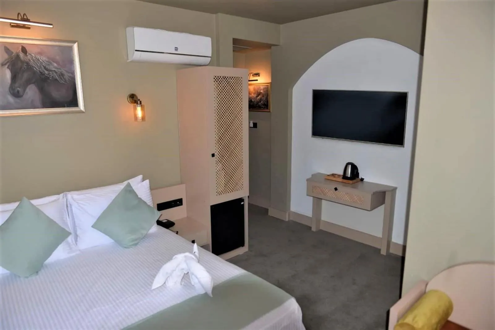 Bed in By Kinyas Hotel